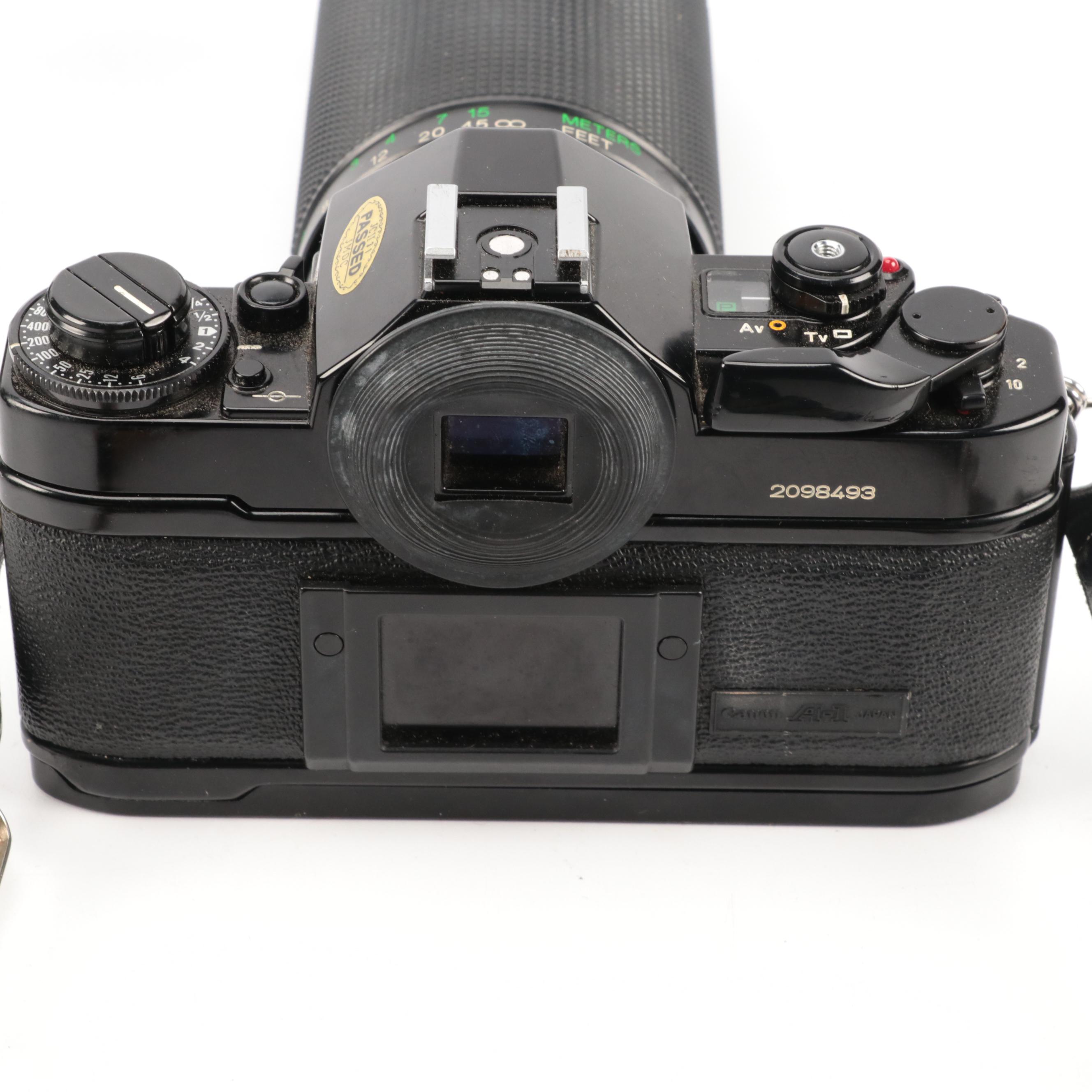 Canon A-1 and Pentax K1000 SLR Cameras with Sigma Lenses
