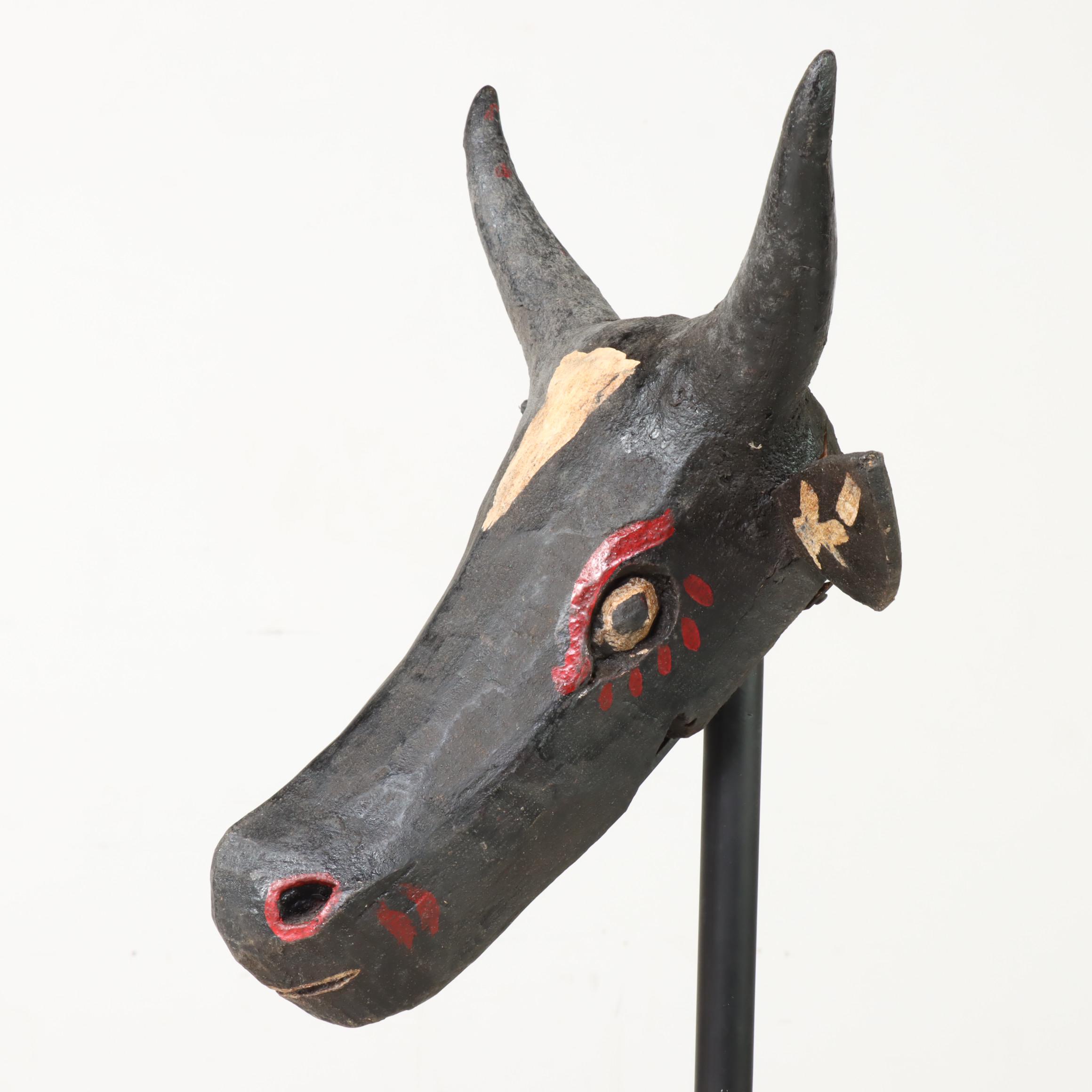 Carved and Polychrome-Decorated Nandi Head with Iron Stand
