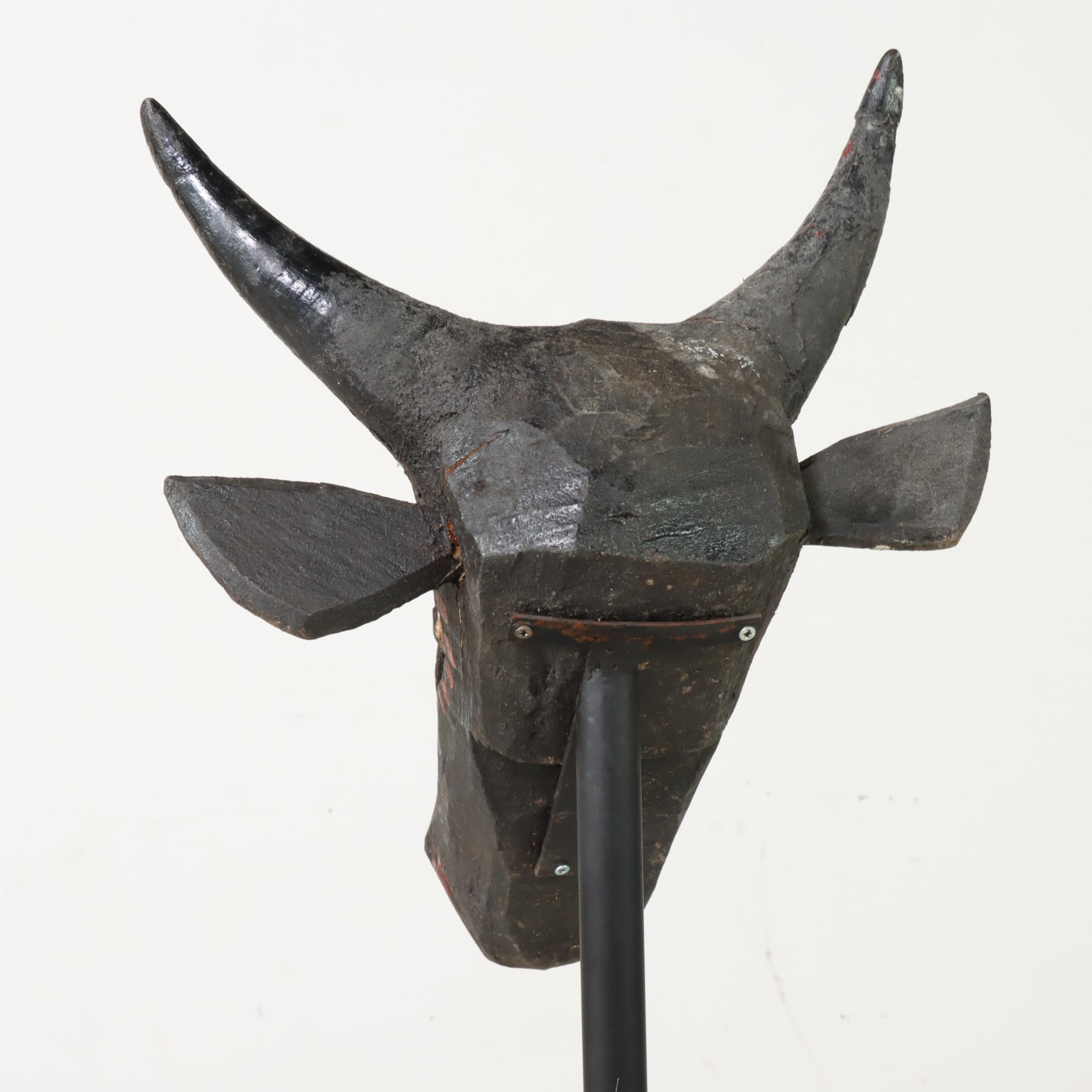 Carved and Polychrome-Decorated Nandi Head with Iron Stand