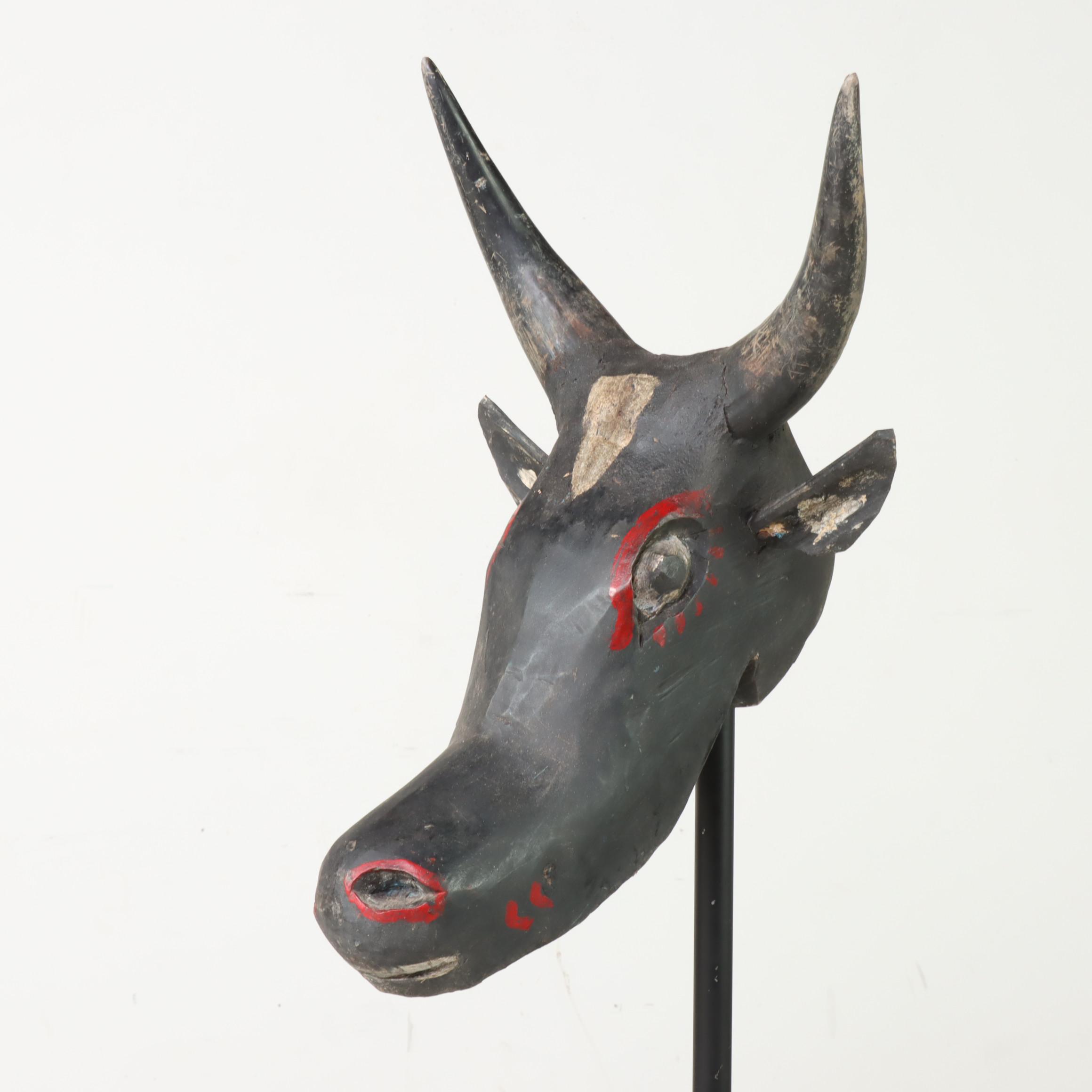 Carved and Polychrome-Decorated Nandi Head with Iron Stand