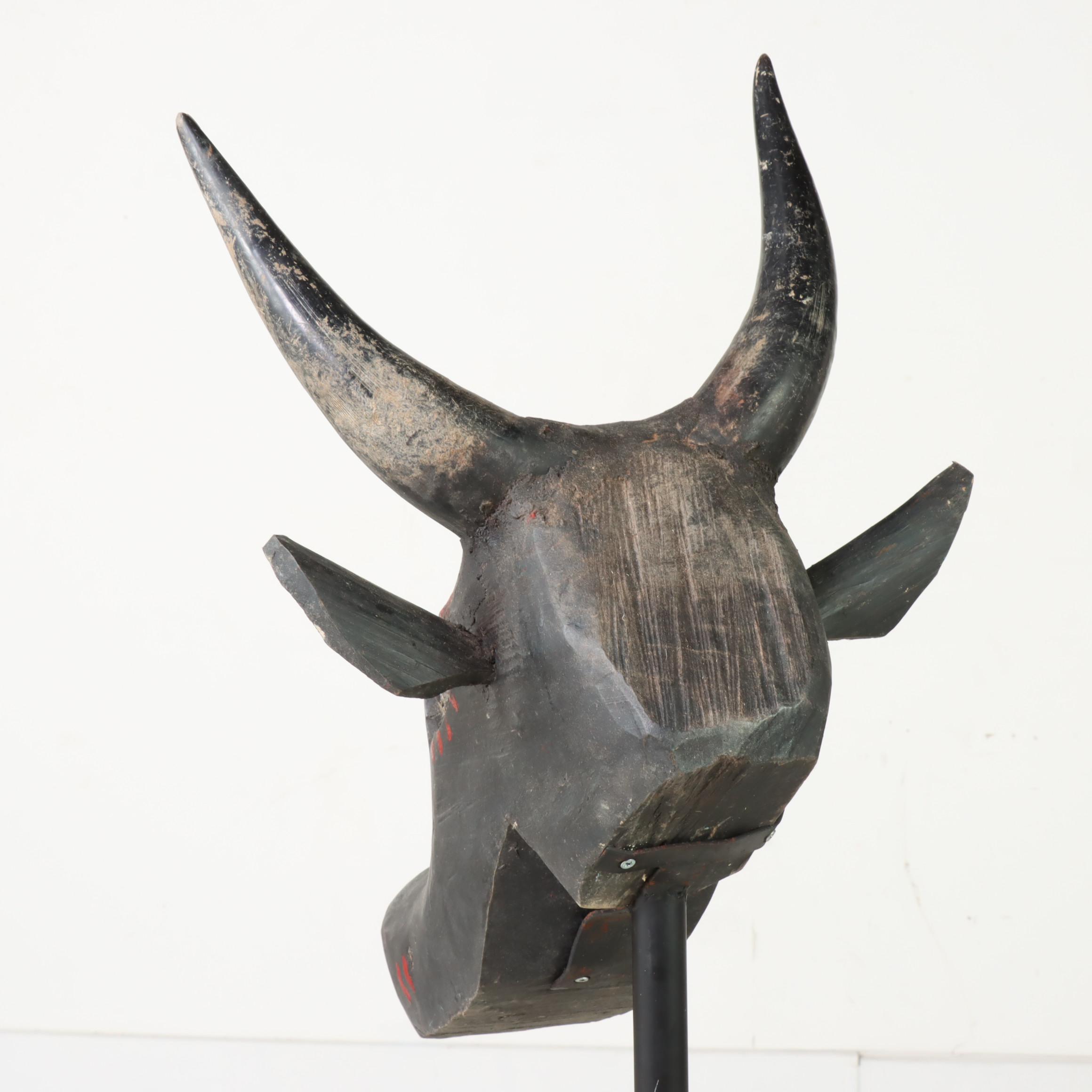 Carved and Polychrome-Decorated Nandi Head with Iron Stand