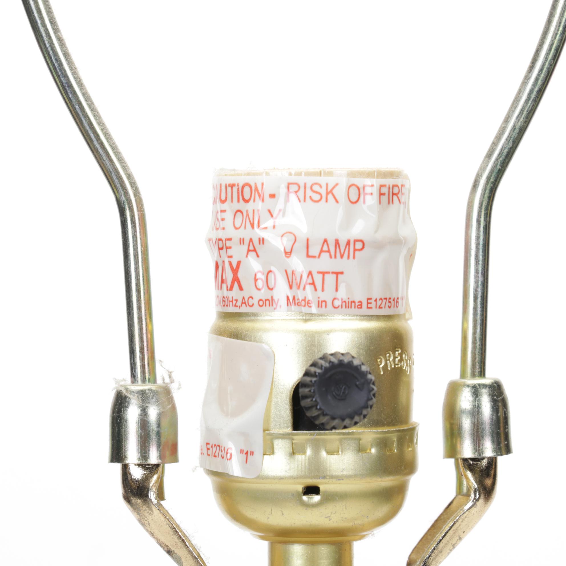 Pair of Bronzed Composite Candlestick Console Lamps With Carved Buddha Head