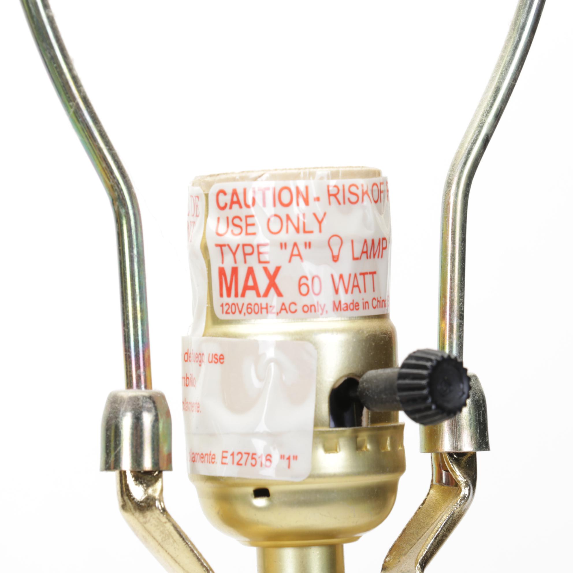 Pair of Bronzed Composite Candlestick Console Lamps With Carved Buddha Head