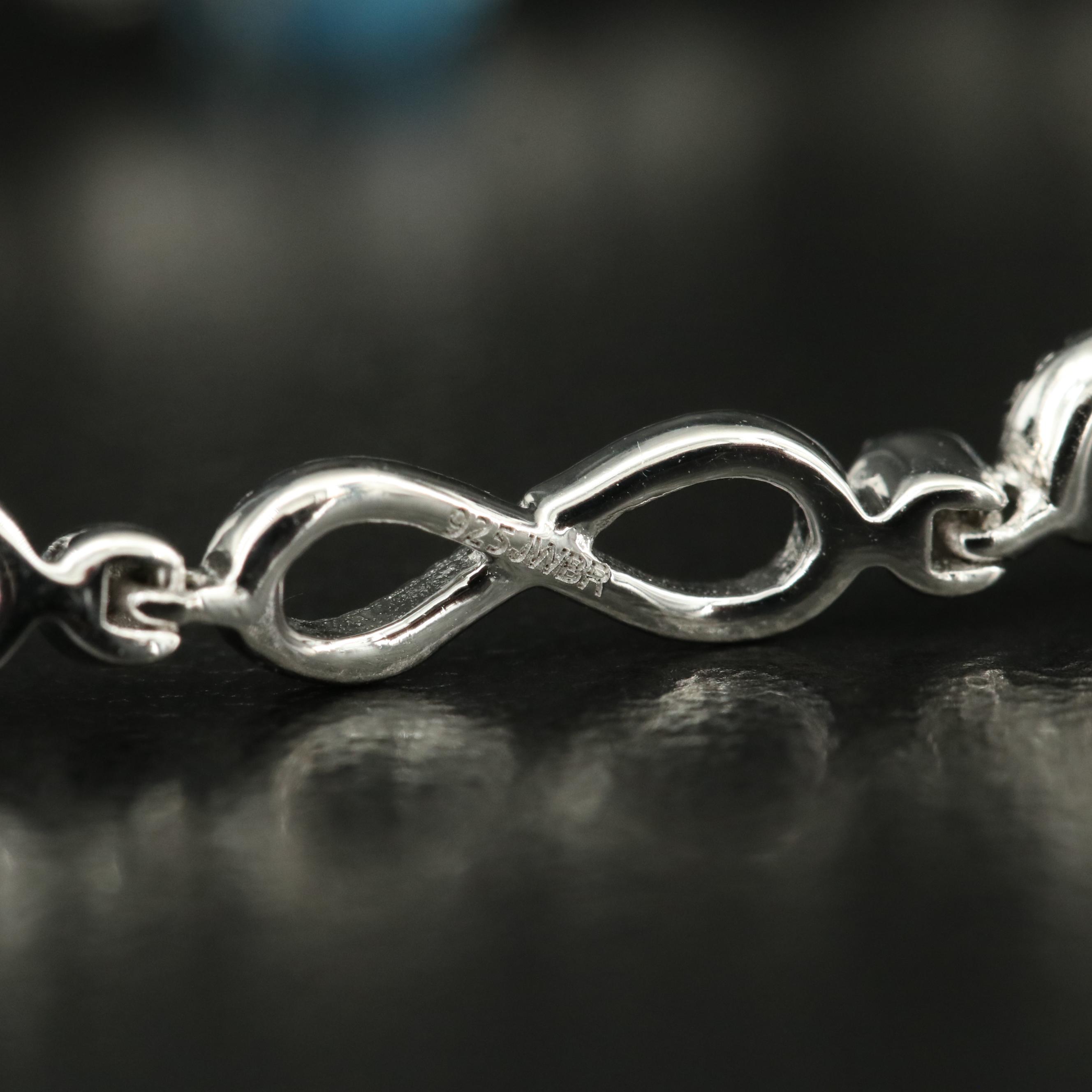 Sterling Swiss Blue Topaz Infinity and Heart Bracelet