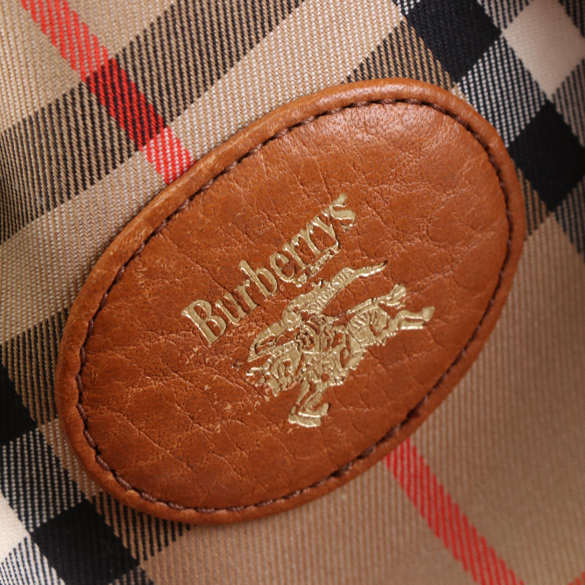 Burberrys Duffle Bag in "Haymarket Check" Canvas and Grained Leather