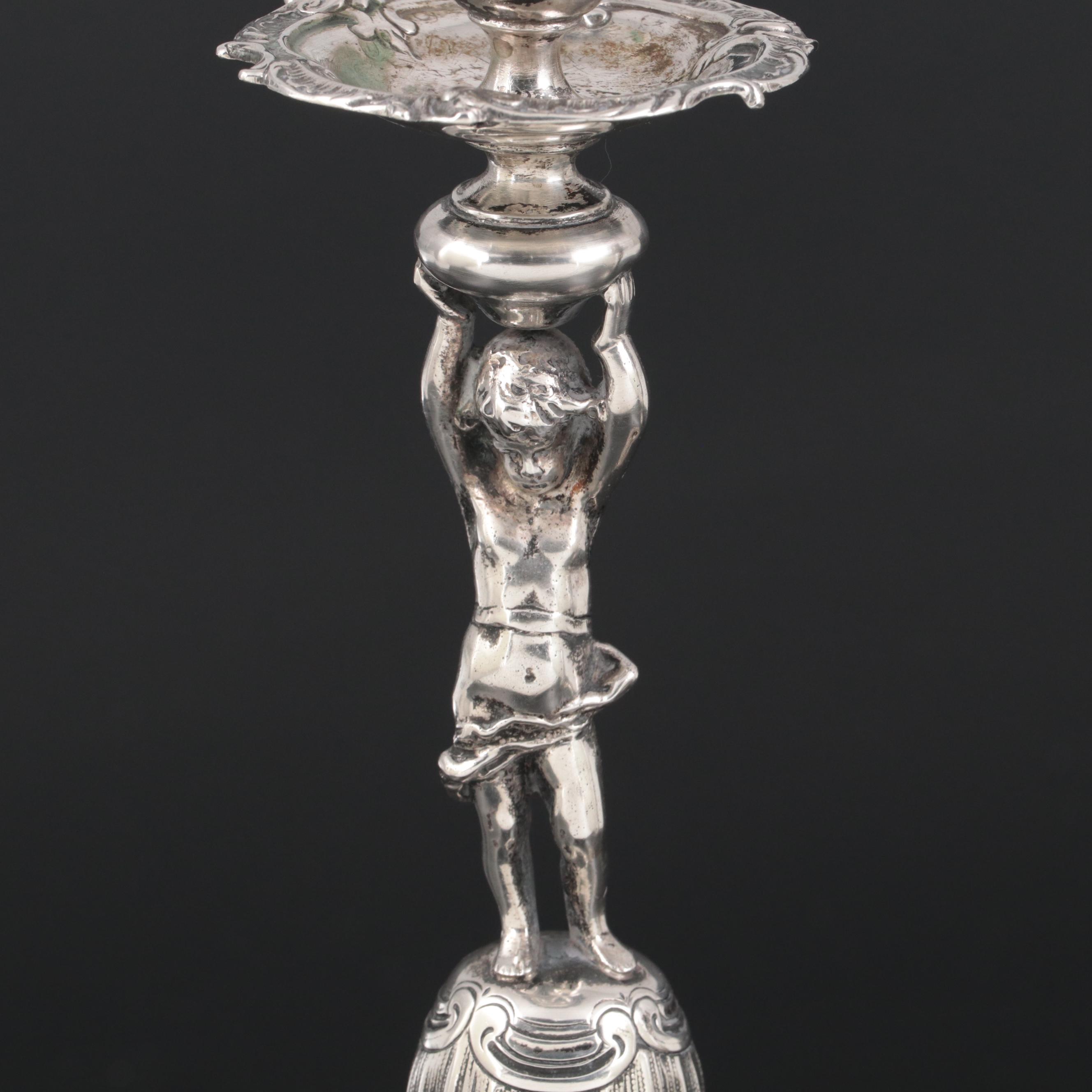 Pair of German 800 Silver Figural Candlesticks