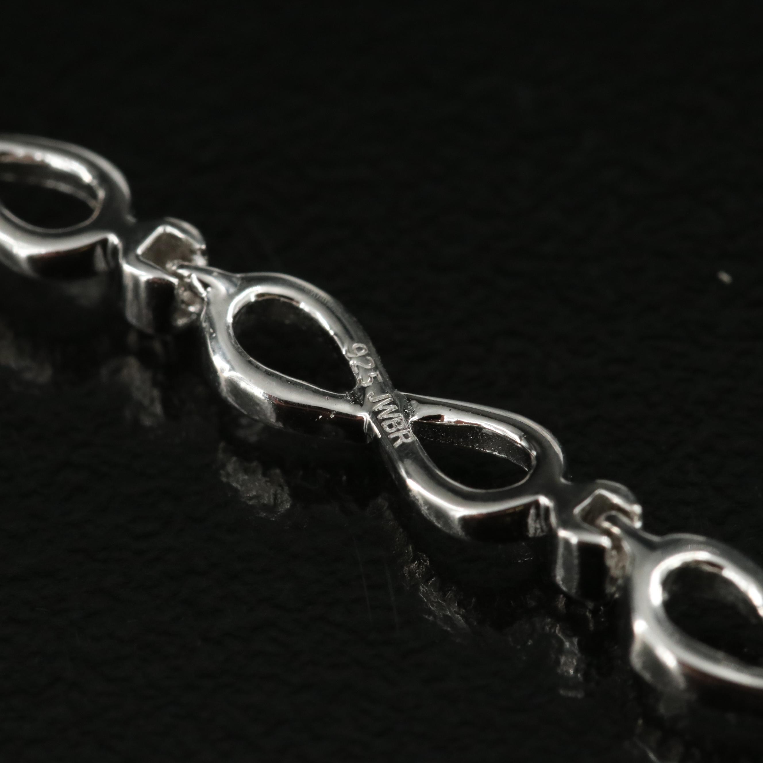 Sterling Swiss Blue Topaz Heart and Infinity Bracelet