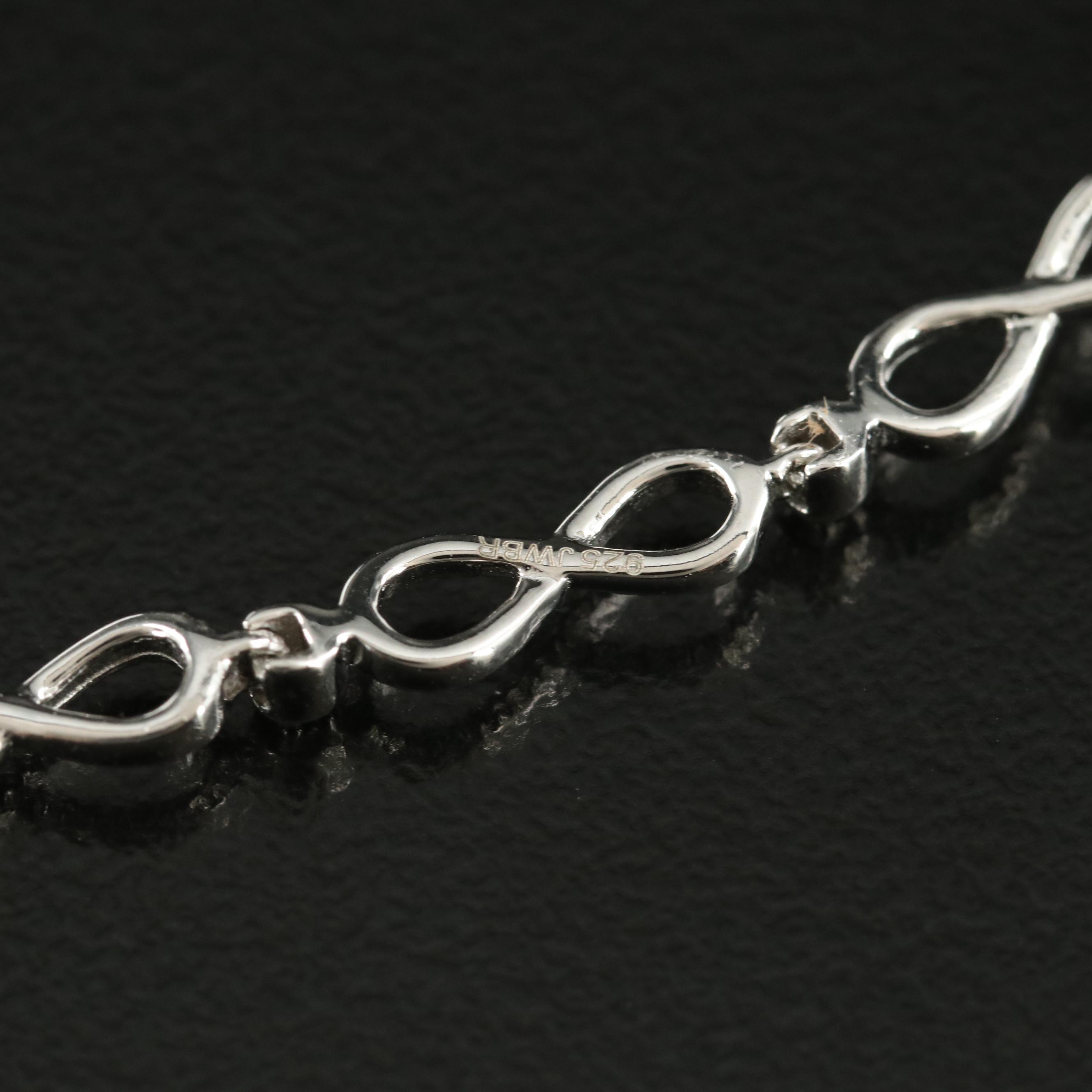 Sterling Swiss Blue Topaz Infinity and Heart Bracelet