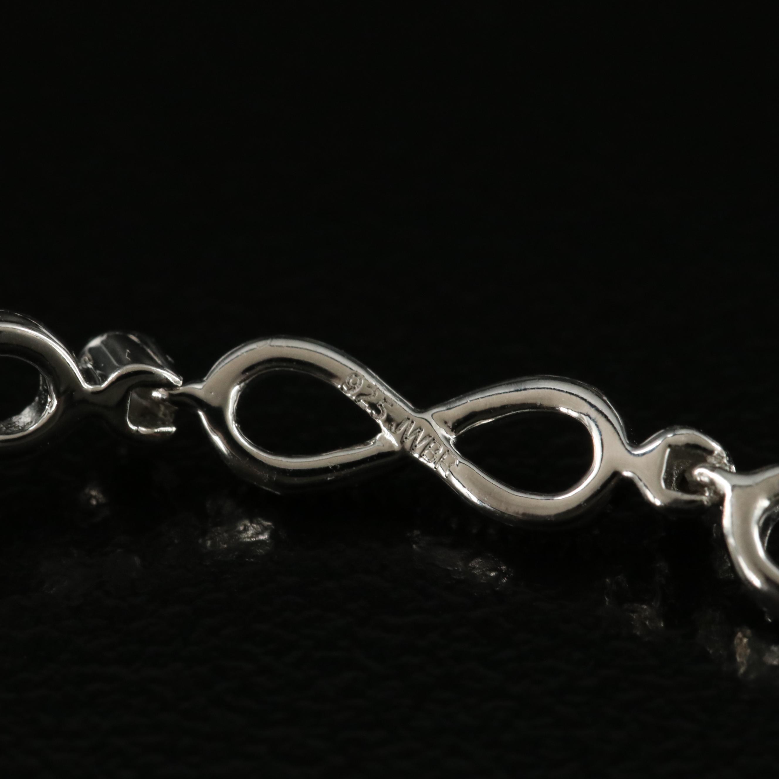 Sterling Swiss Blue Topaz Infinity and Heart Bracelet