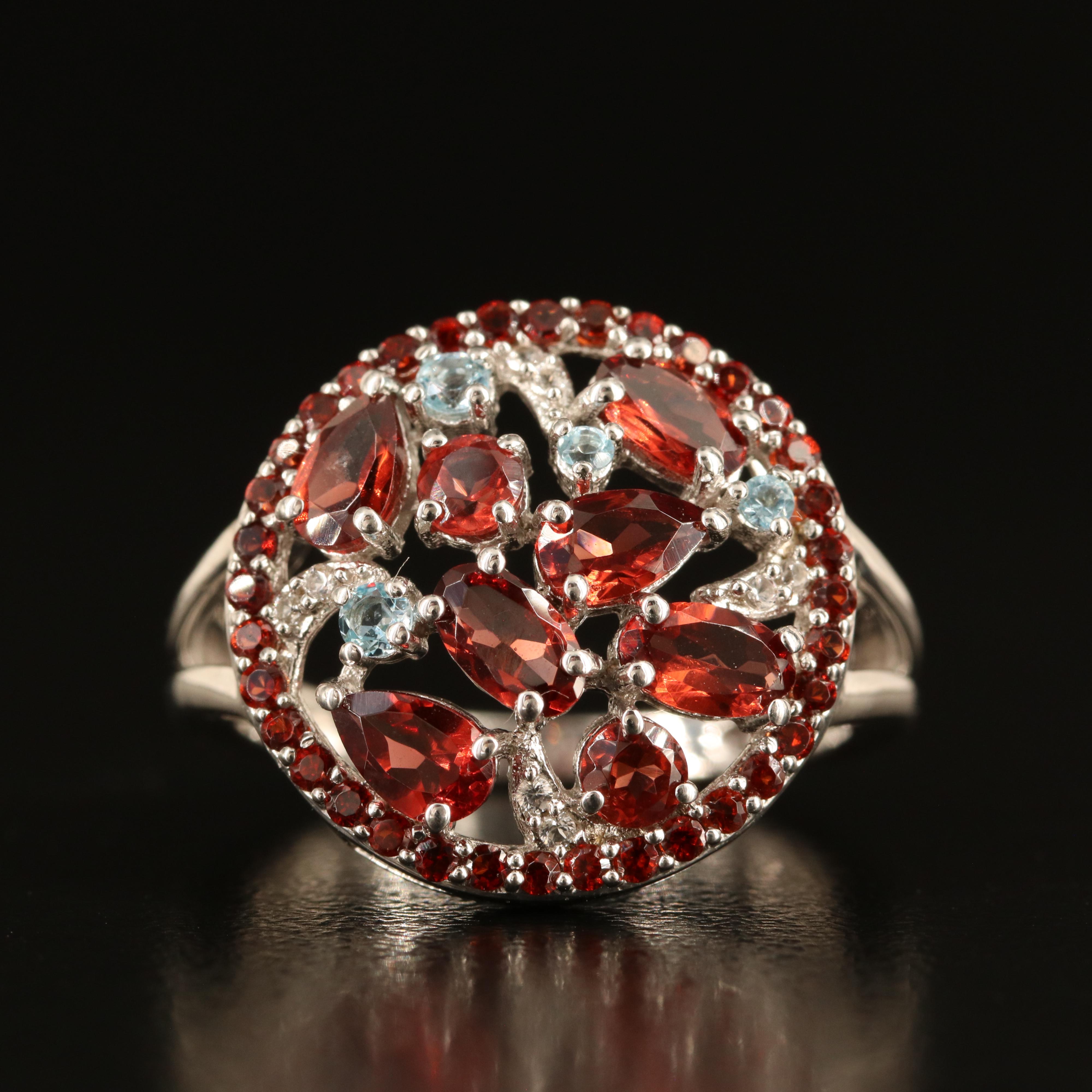 Sterling Garnet, Sky Blue Topaz and White Sapphire Cluster Ring