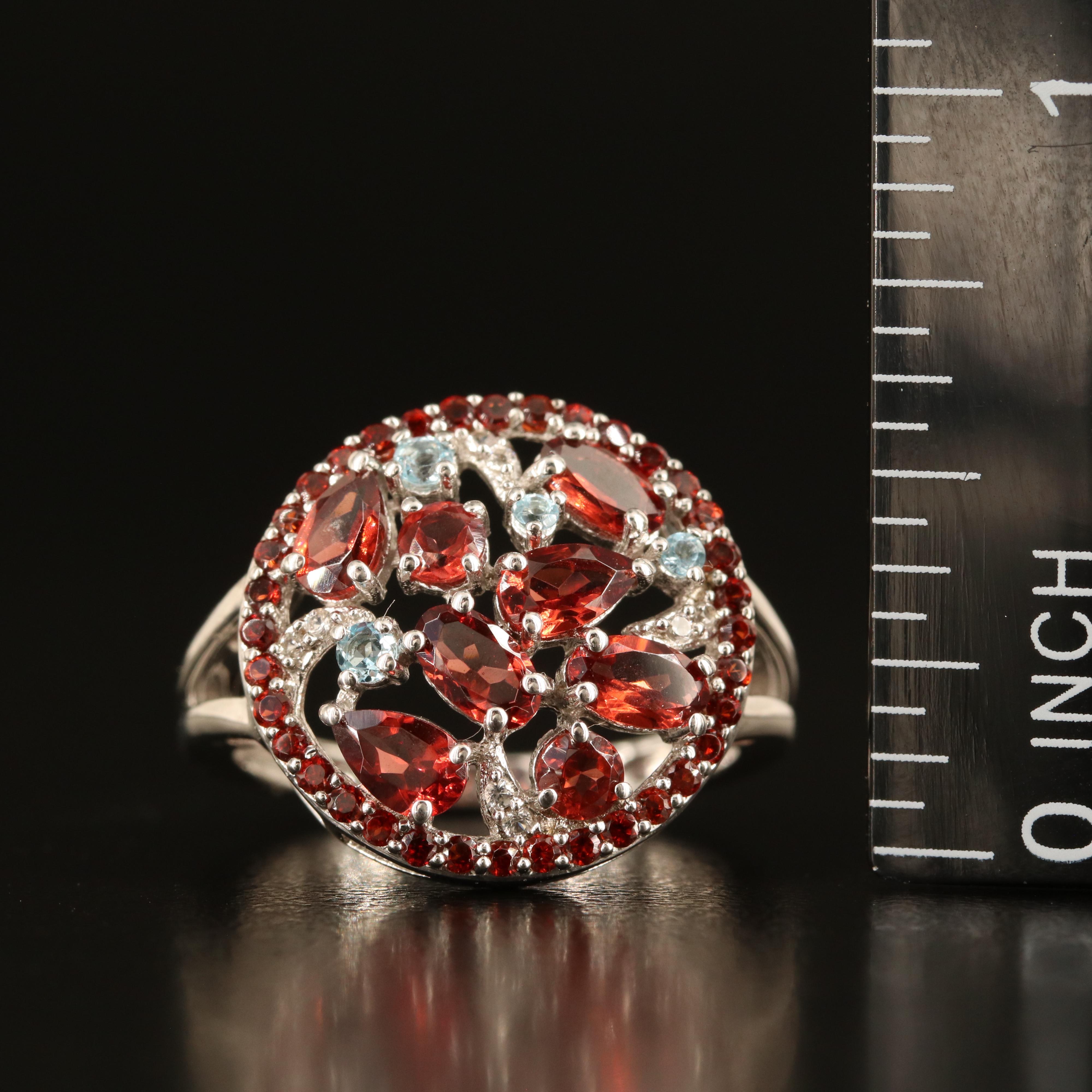 Sterling Garnet, Sky Blue Topaz and White Sapphire Cluster Ring