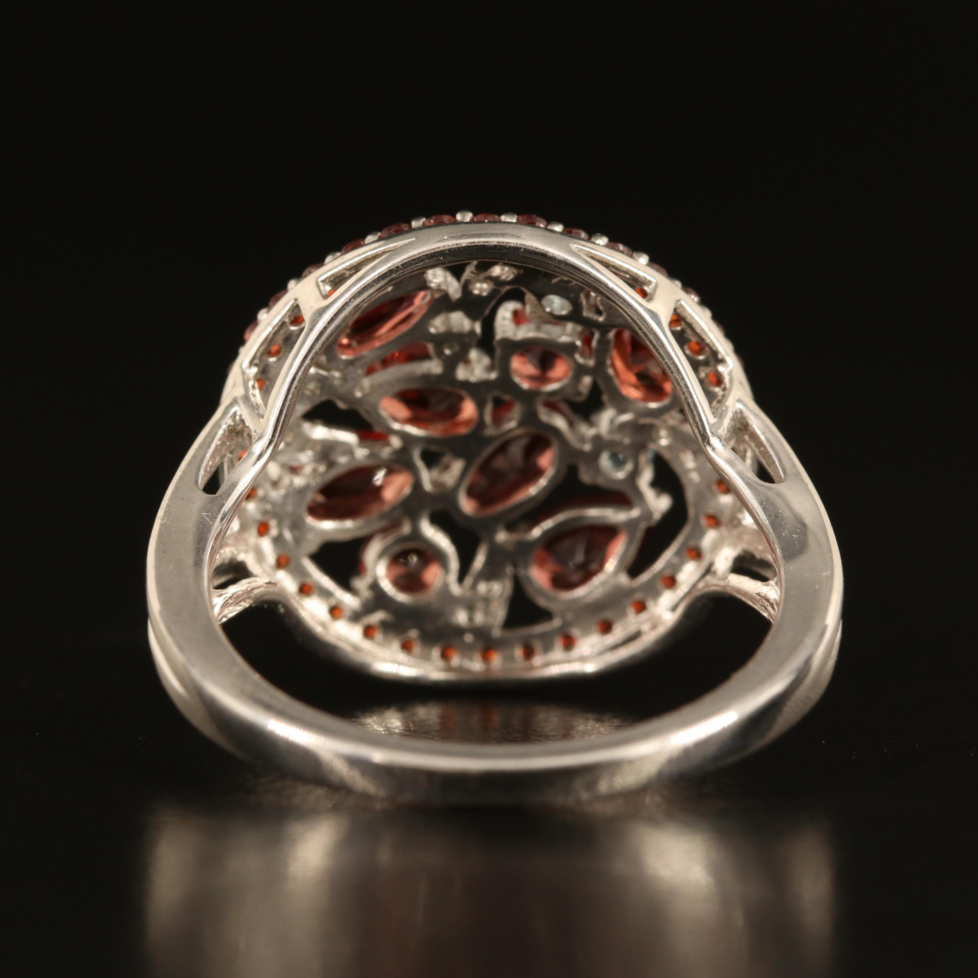 Sterling Garnet, Sky Blue Topaz and White Sapphire Cluster Ring