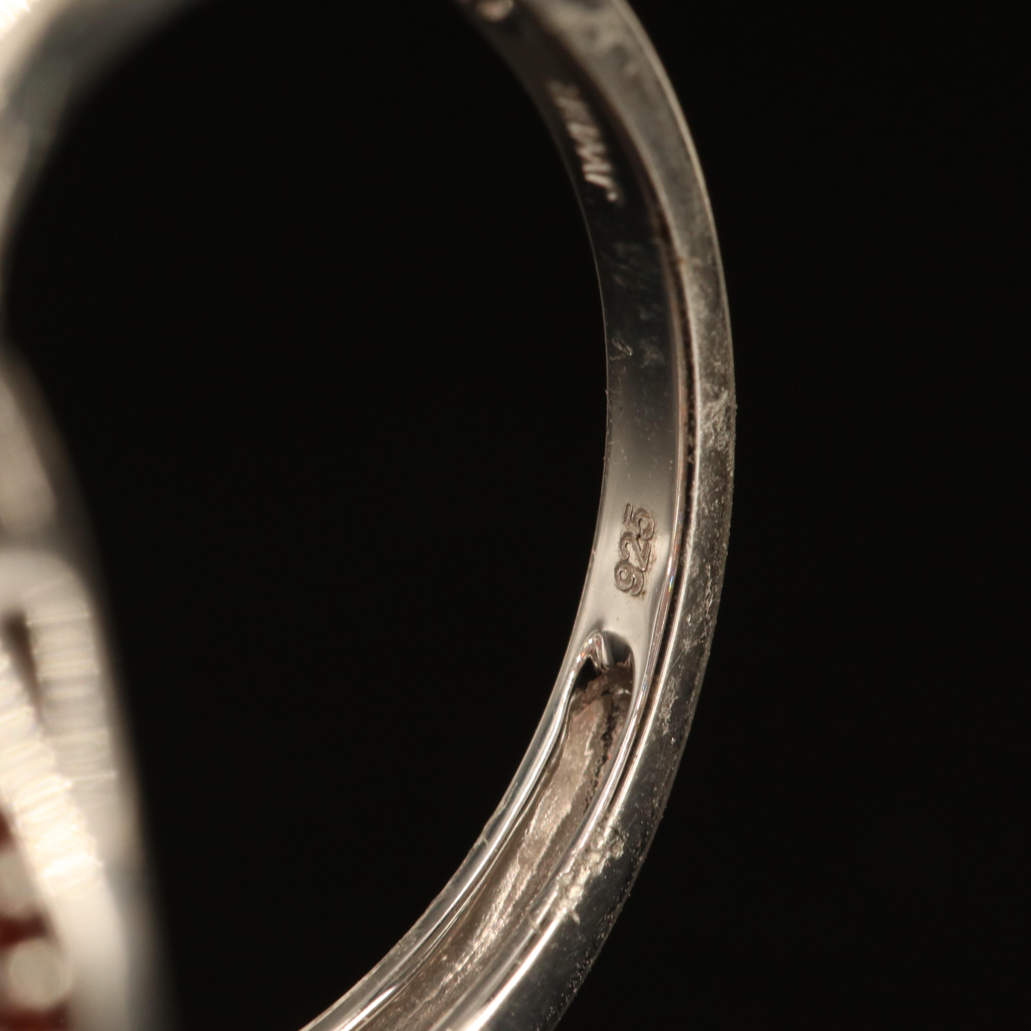 Sterling Garnet, Sky Blue Topaz and White Sapphire Cluster Ring