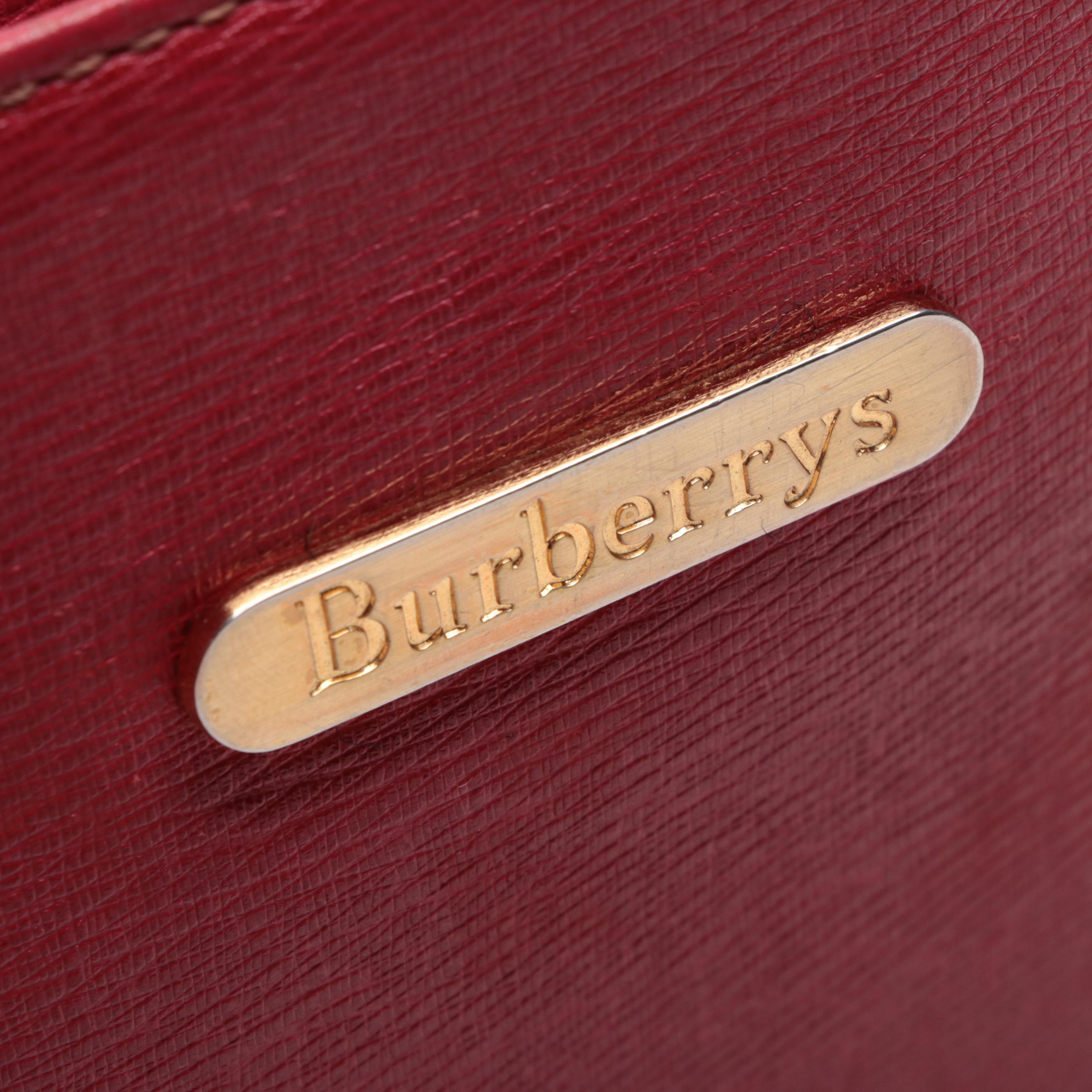 Burberrys Top Handle Handbag in Red Cross Grain Textured and Patent Leather