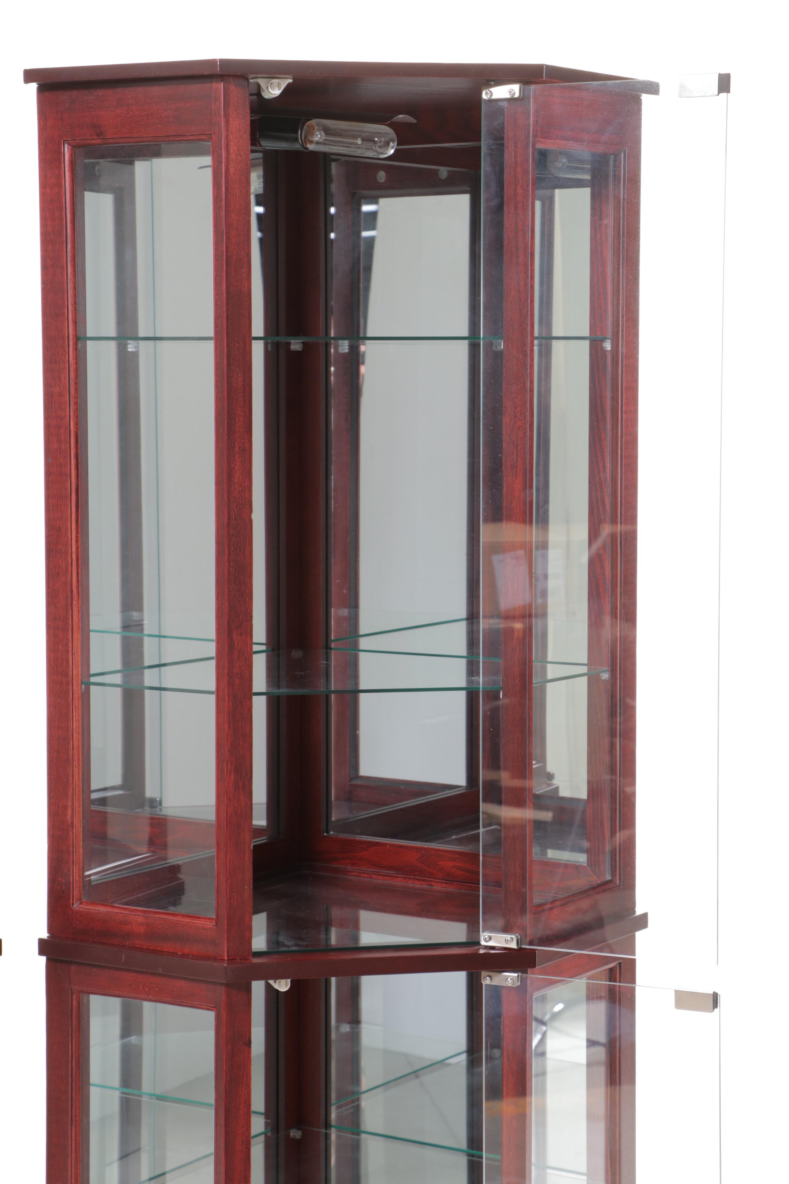 Pair of Mahogany Finish and Glass Illuminated Corner Display Cabinets