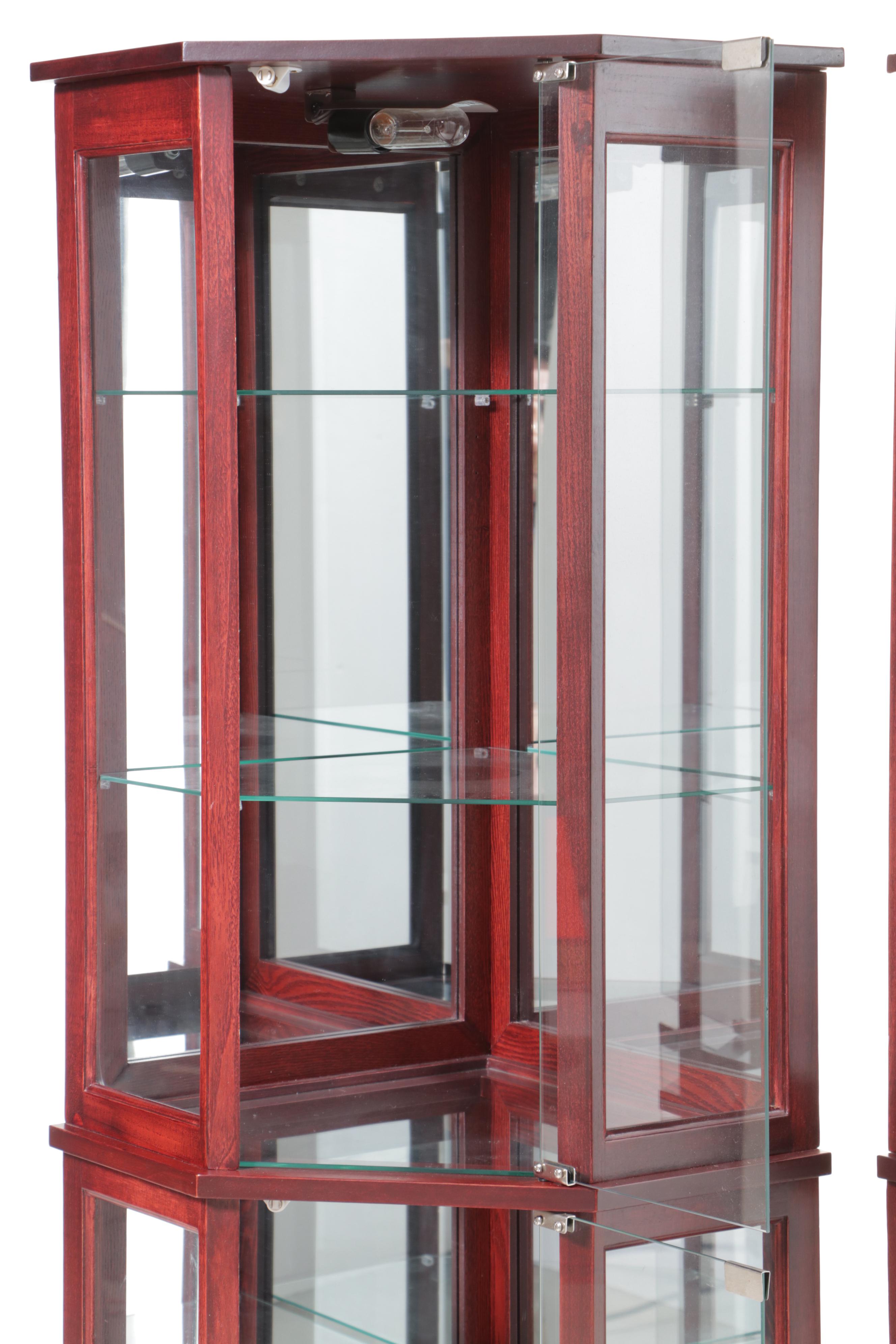 Pair of Mahogany Finish and Glass Illuminated Corner Display Cabinets