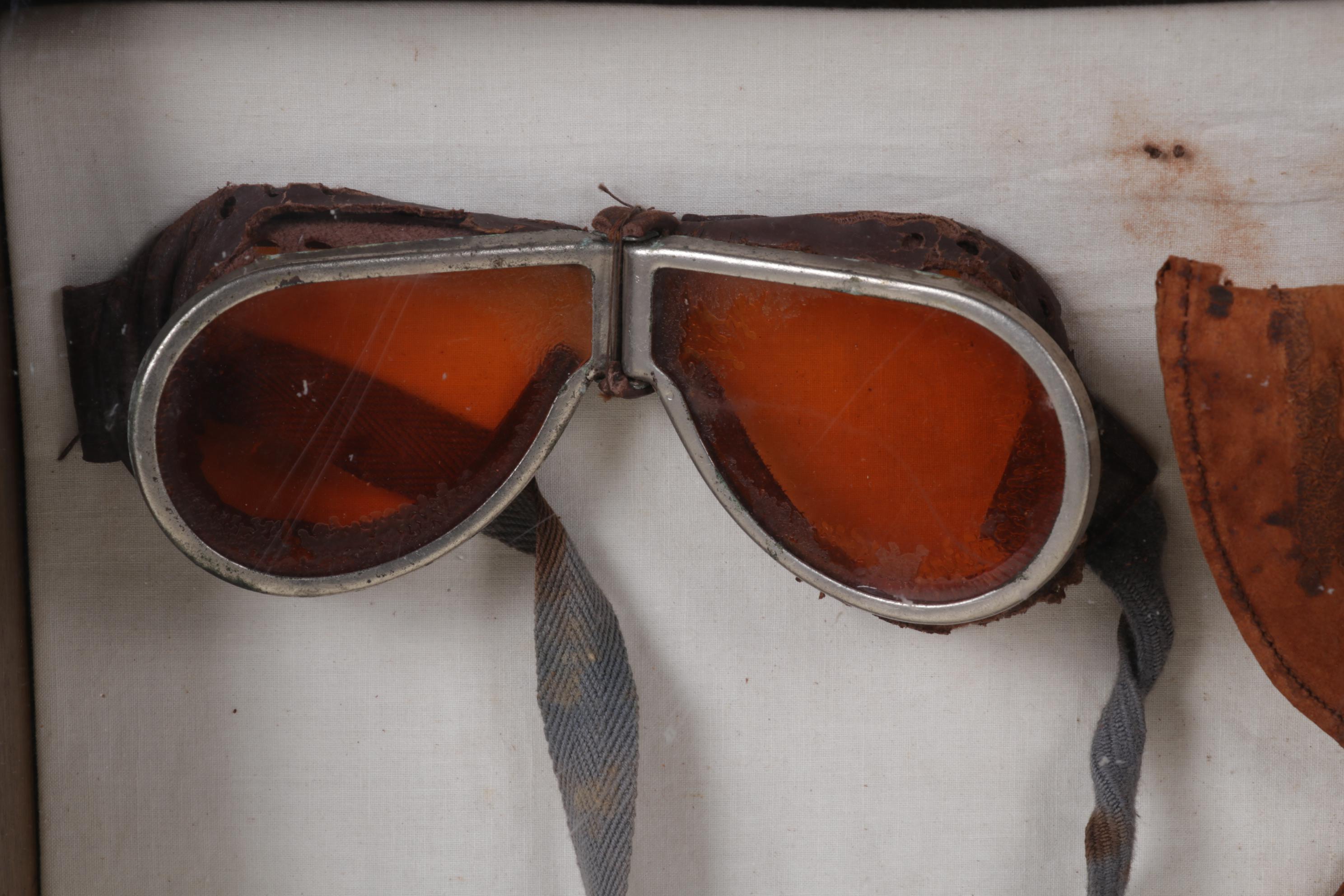 Aviator Goggles, Leather Cap, and Insignia in Frame, Circa 1930