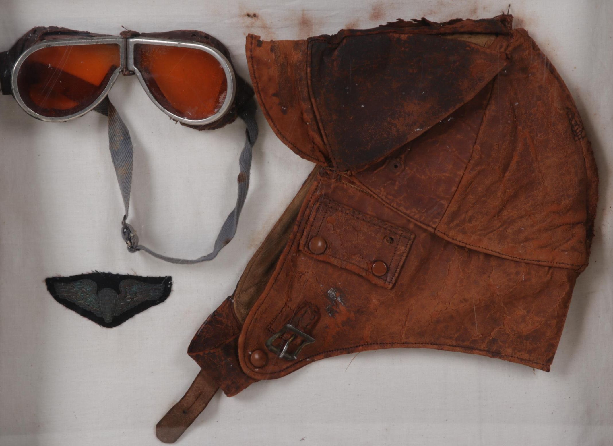 Aviator Goggles, Leather Cap, and Insignia in Frame, Circa 1930