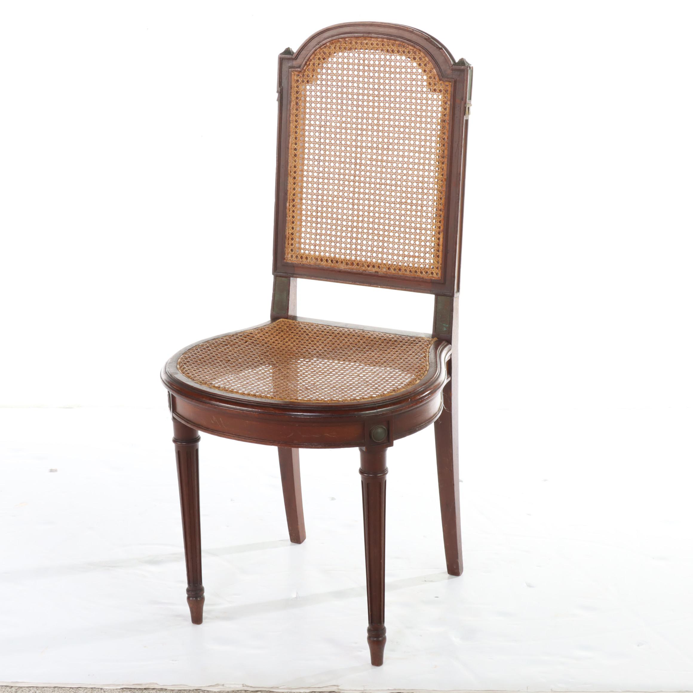 Pair of Louis XVI Style Gilt Metal-Mounted Walnut and Caned Salon Chairs