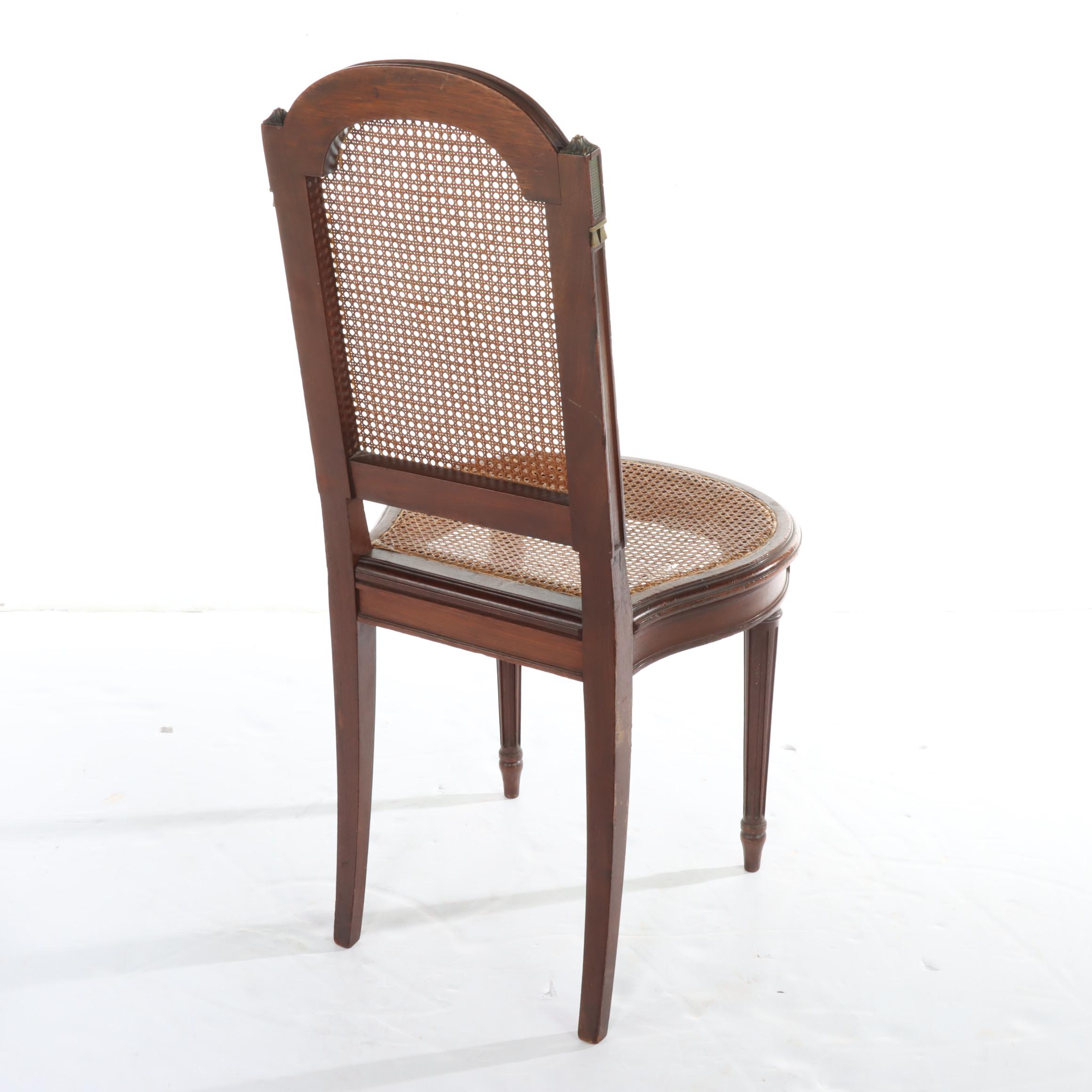 Pair of Louis XVI Style Gilt Metal-Mounted Walnut and Caned Salon Chairs