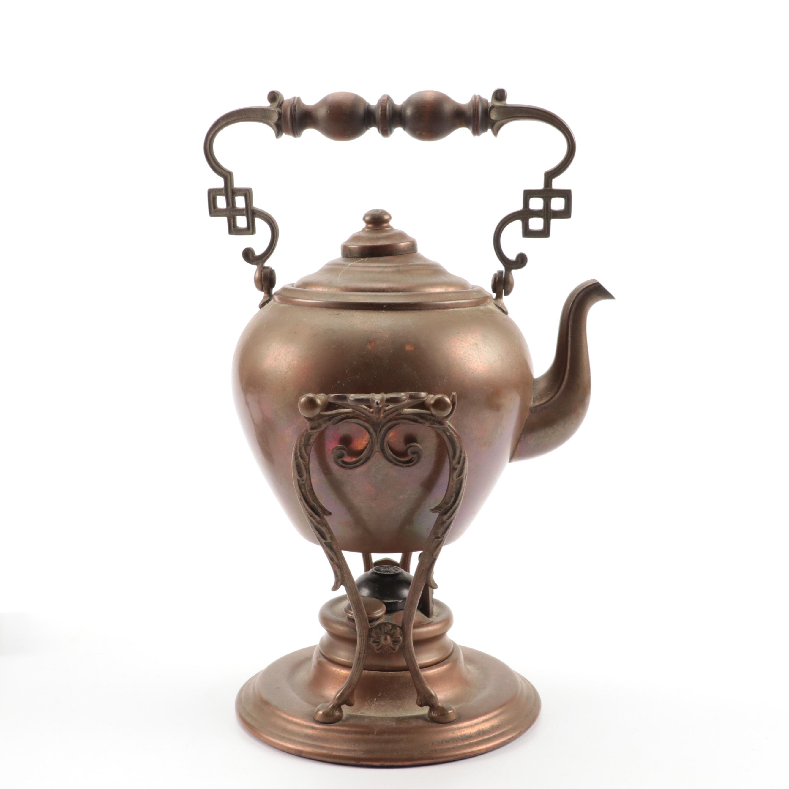 Copper Tilting Teapot with Burner and Ballister Form Brass Candlesticks
