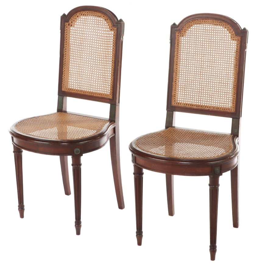 Pair of Louis XVI Style Gilt Metal-Mounted Walnut and Caned Salon Chairs