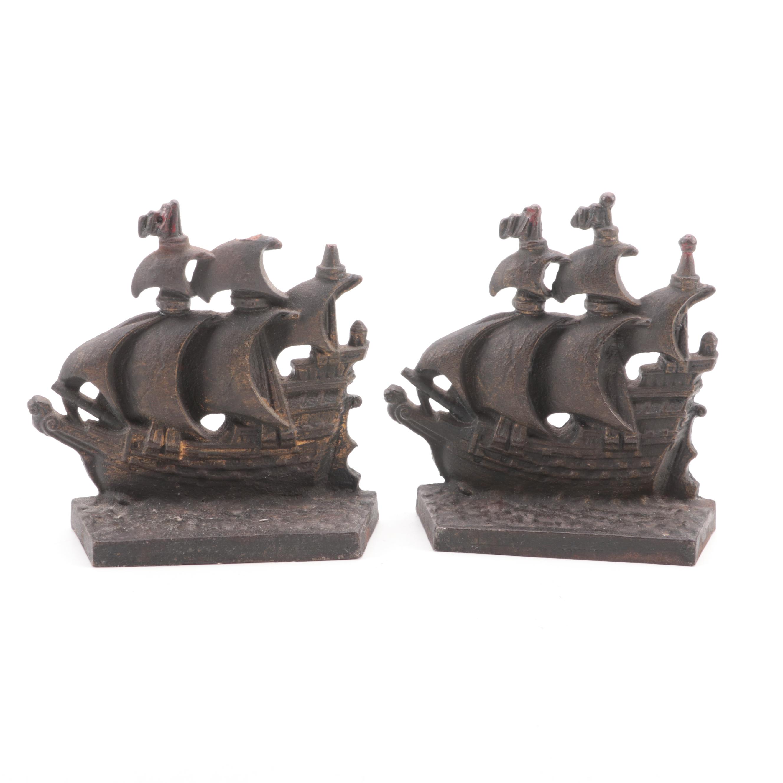 D.W. Haber & Son Silver Plate Candelabra and Pair of Cast Iron Galleon Doorstops
