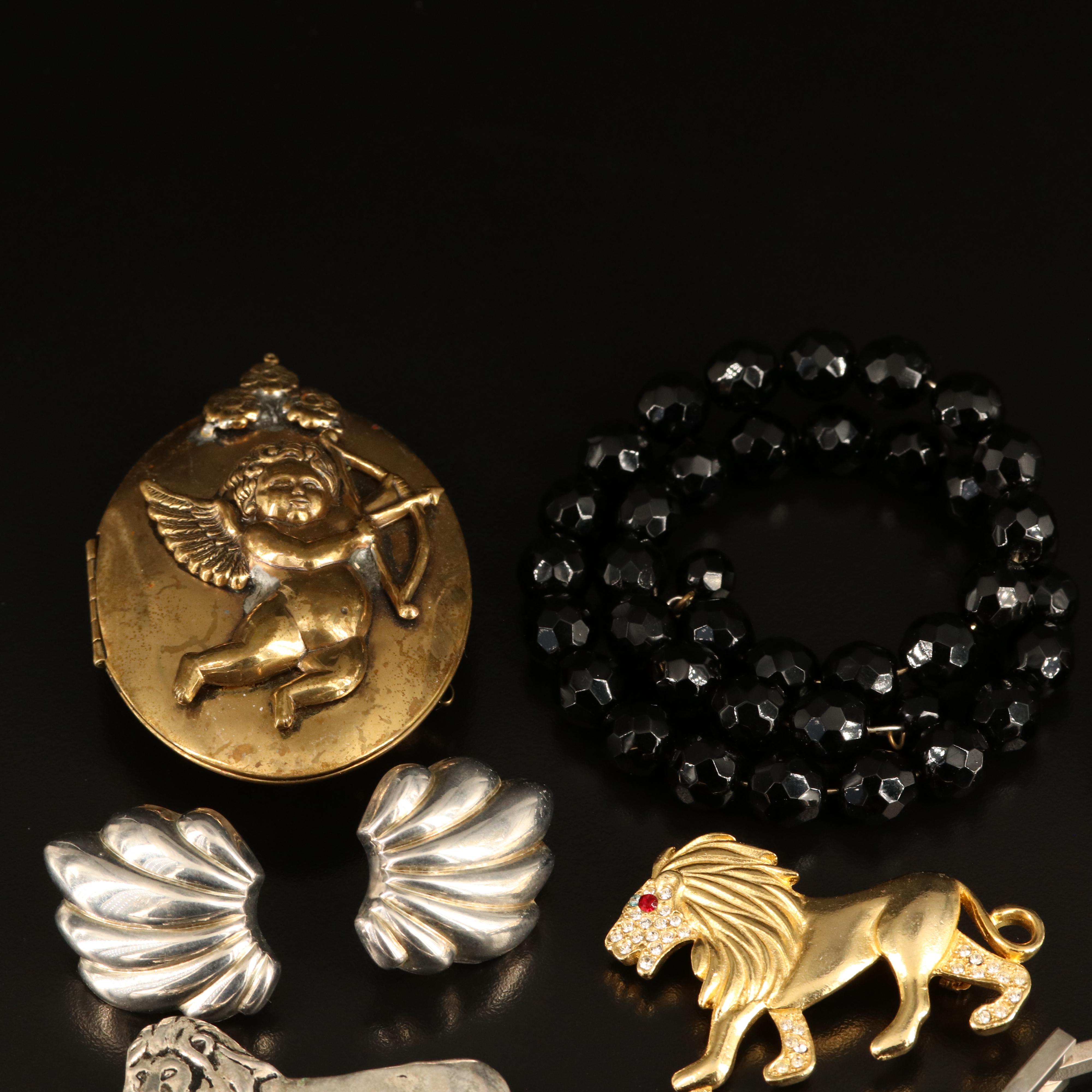 Rhinestones, Cherub Locket and Lions Featured in Jewelry Collection