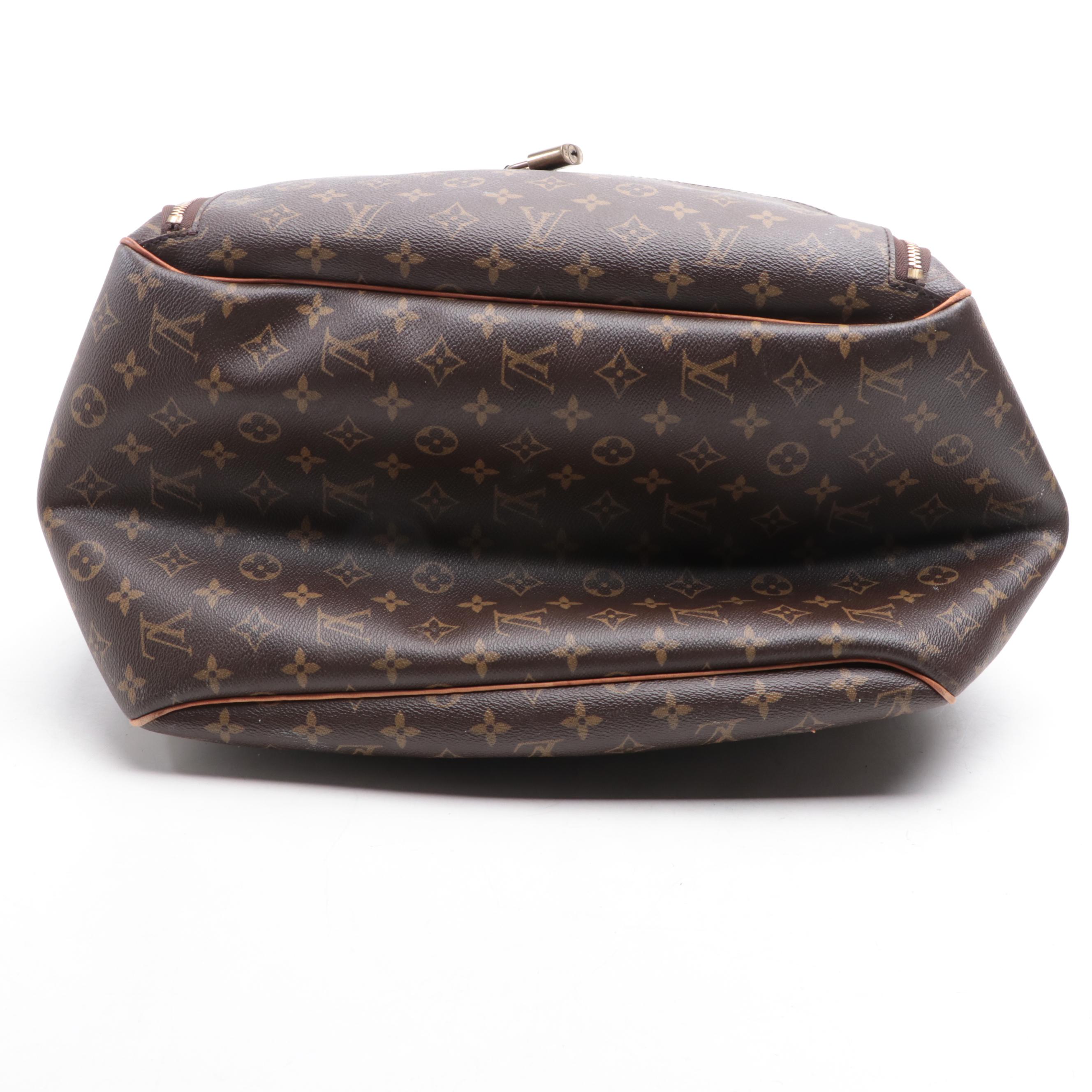 Louis Vuitton Evasion Travel Bag in Monogram Canvas and Vachetta Leather