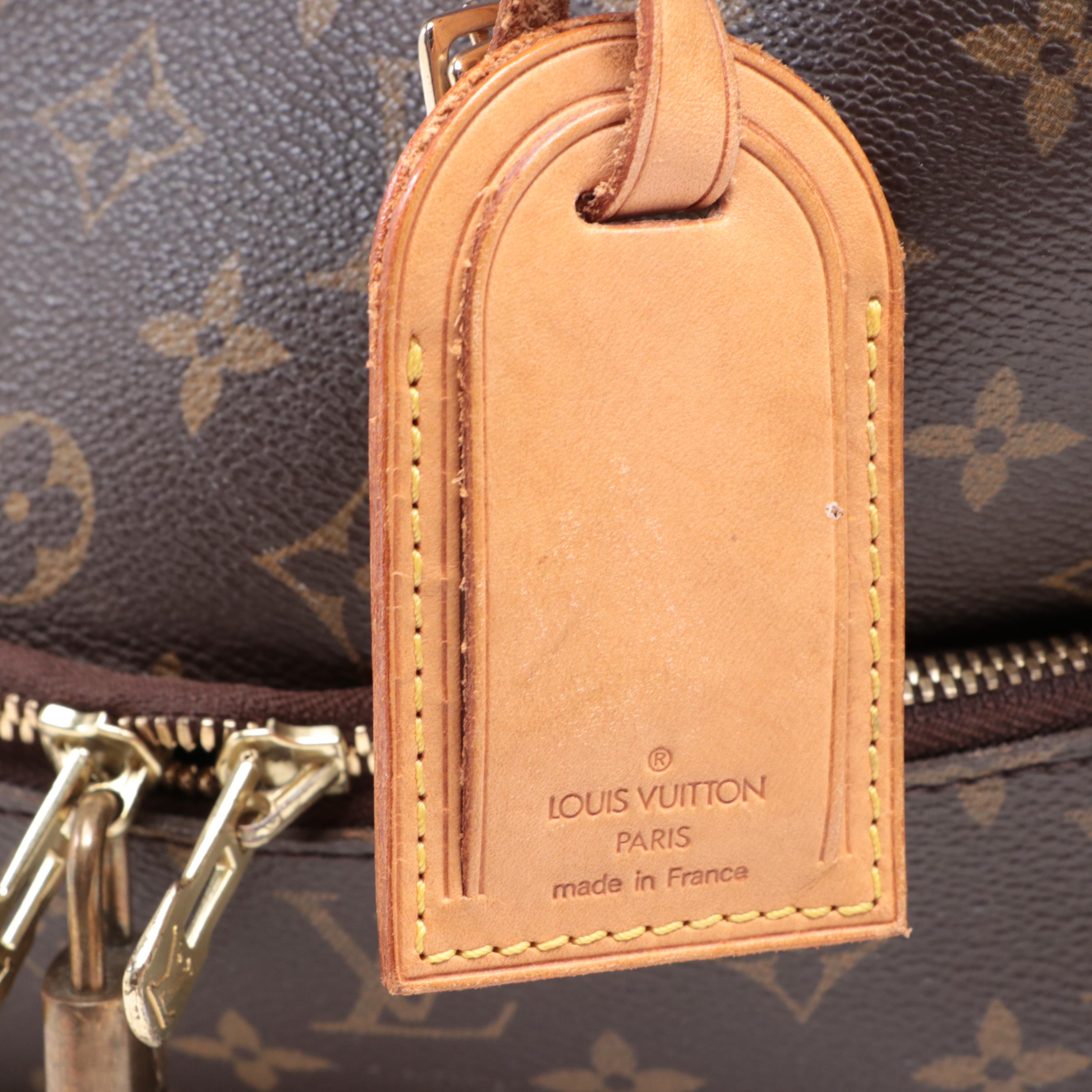 Louis Vuitton Evasion Travel Bag in Monogram Canvas and Vachetta Leather