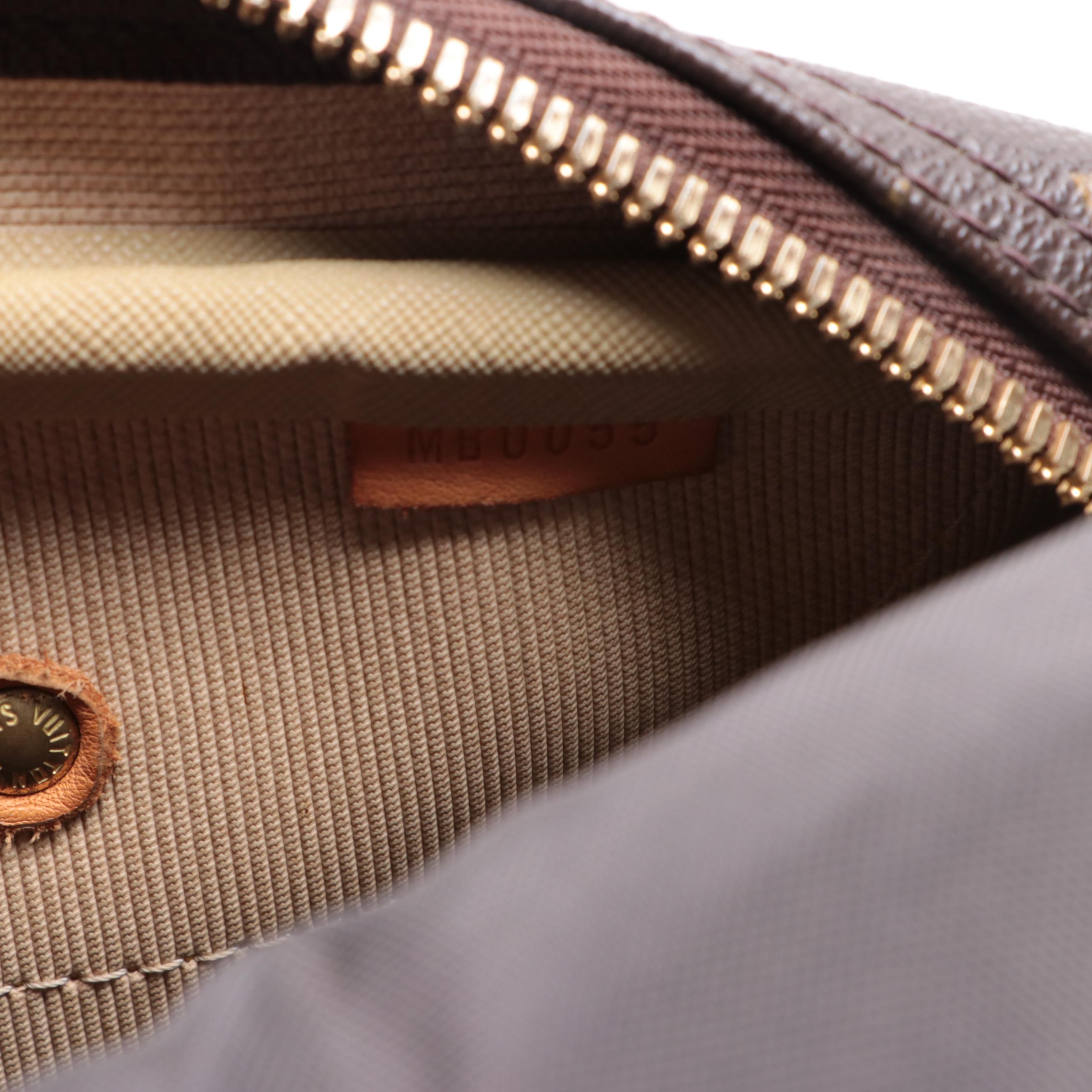 Louis Vuitton Evasion Travel Bag in Monogram Canvas and Vachetta Leather