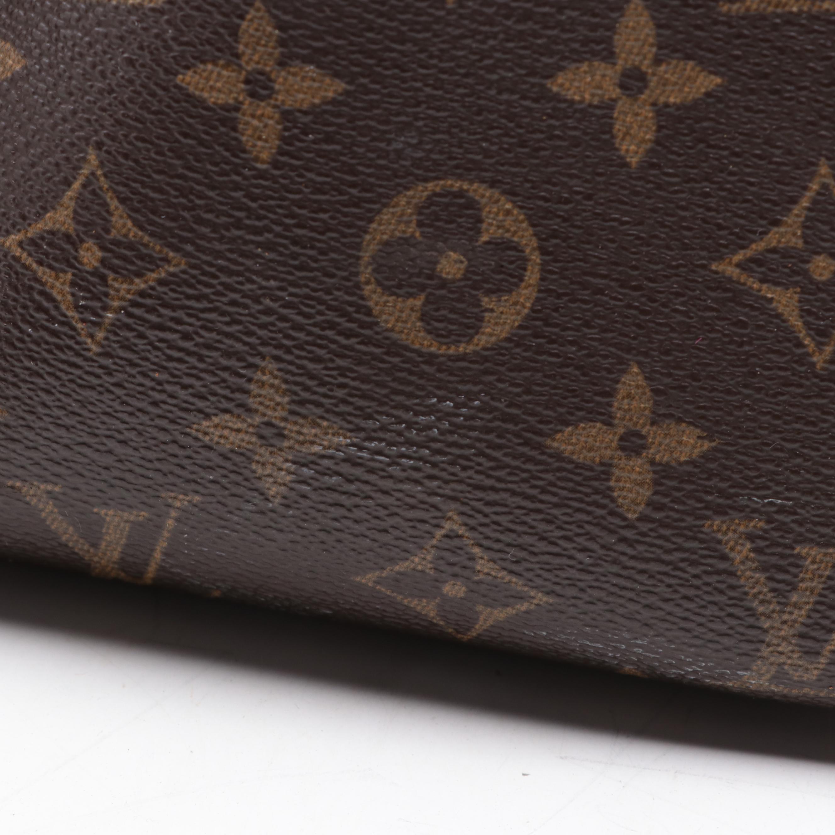 Louis Vuitton Evasion Travel Bag in Monogram Canvas and Vachetta Leather