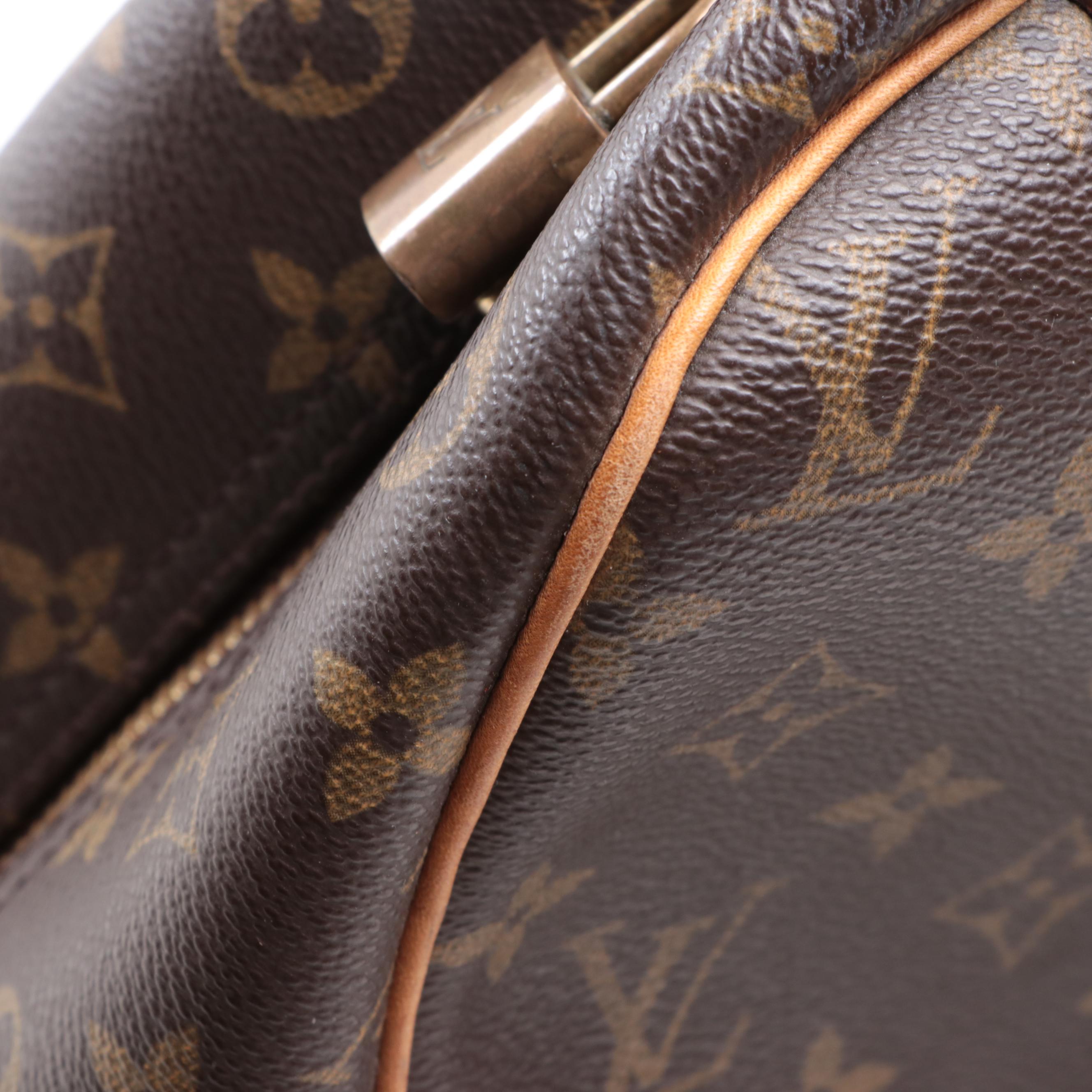 Louis Vuitton Evasion Travel Bag in Monogram Canvas and Vachetta Leather
