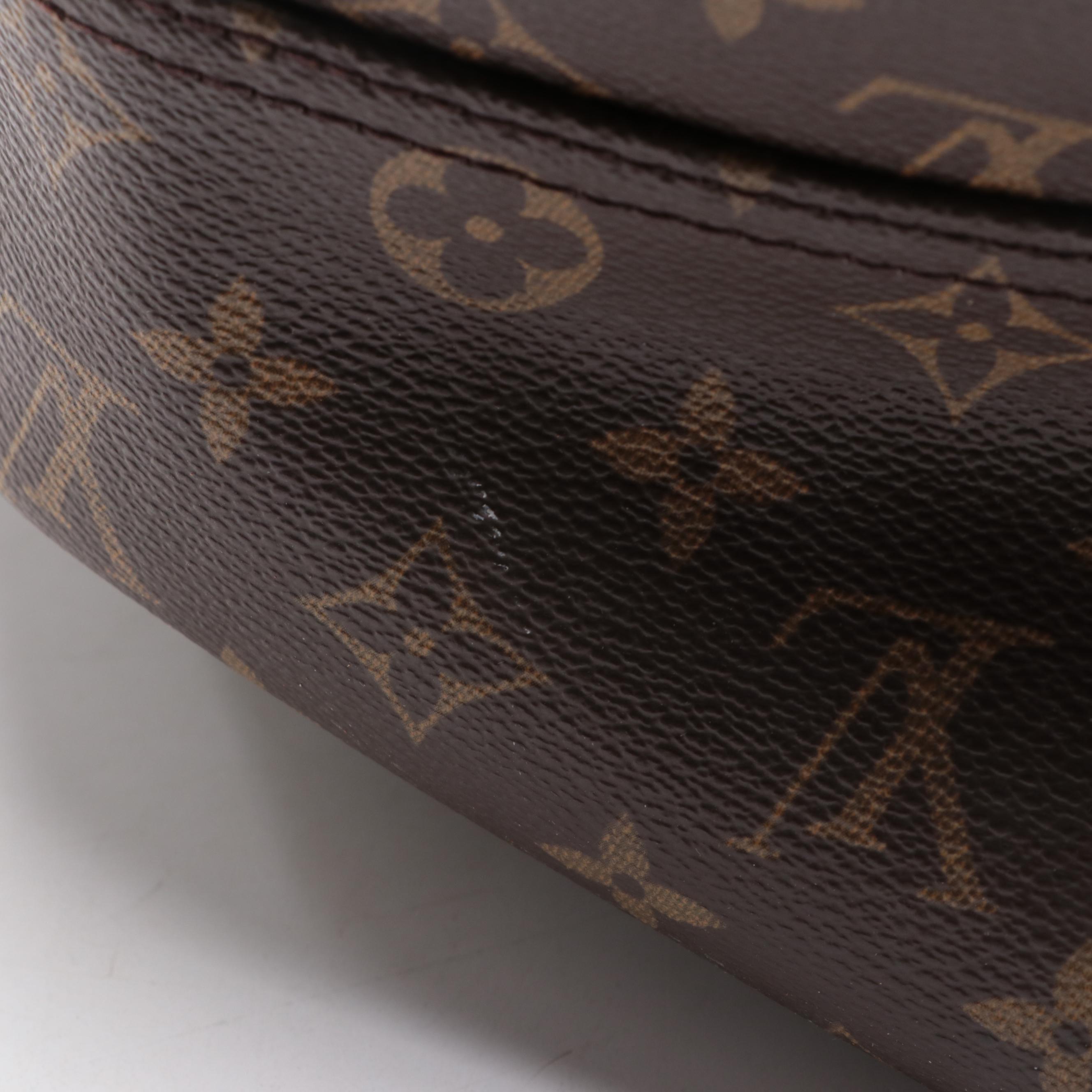 Louis Vuitton Evasion Travel Bag in Monogram Canvas and Vachetta Leather