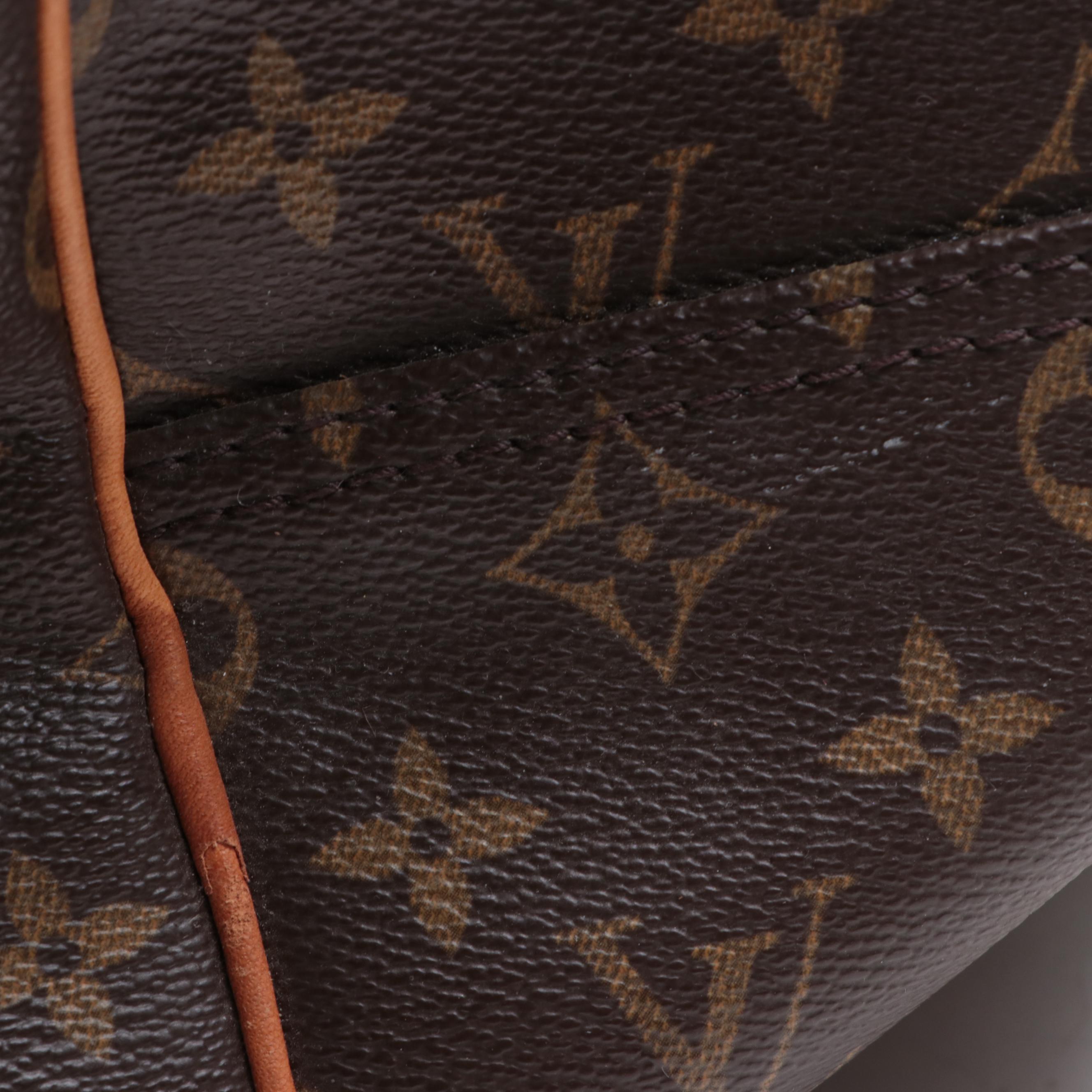 Louis Vuitton Evasion Travel Bag in Monogram Canvas and Vachetta Leather