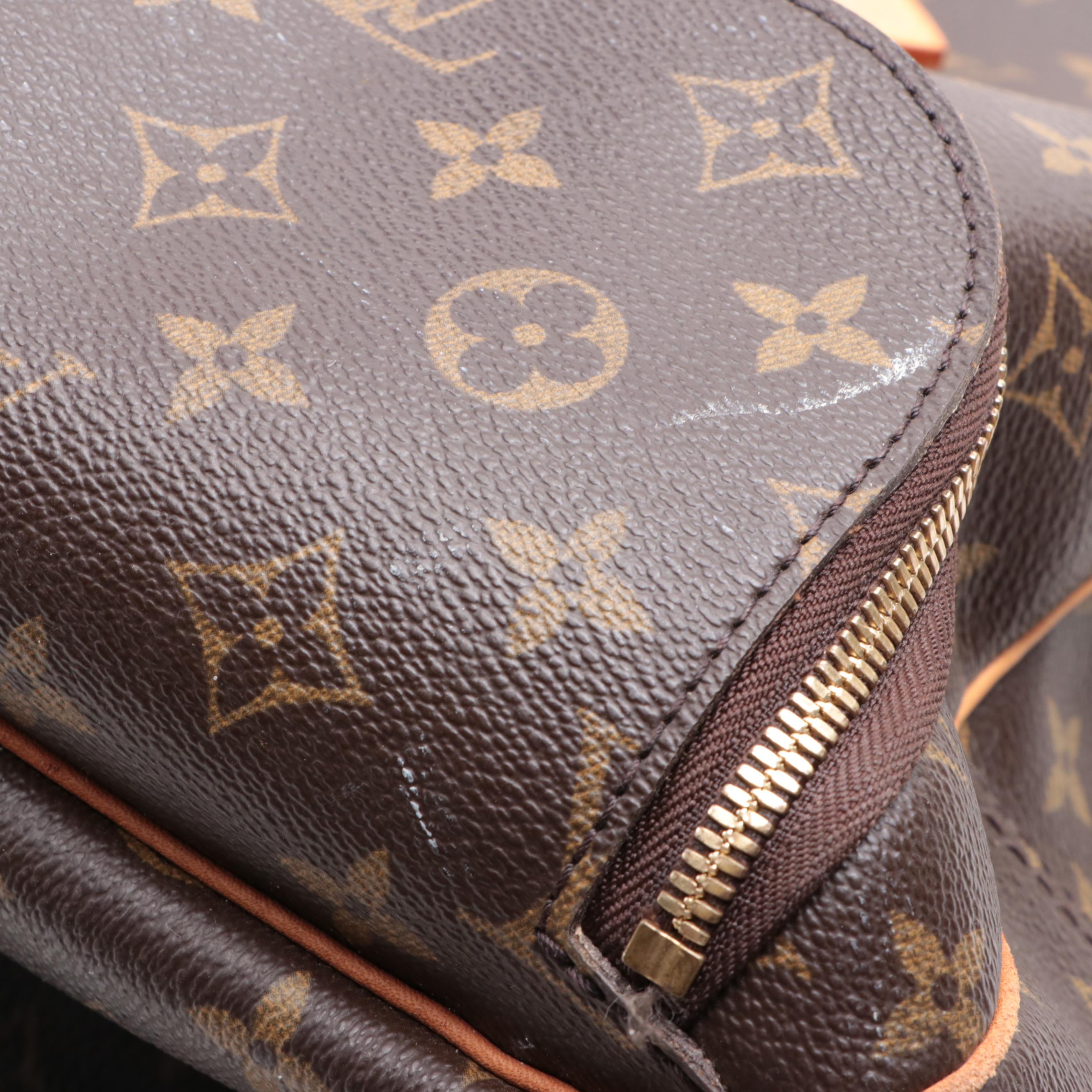 Louis Vuitton Evasion Travel Bag in Monogram Canvas and Vachetta Leather