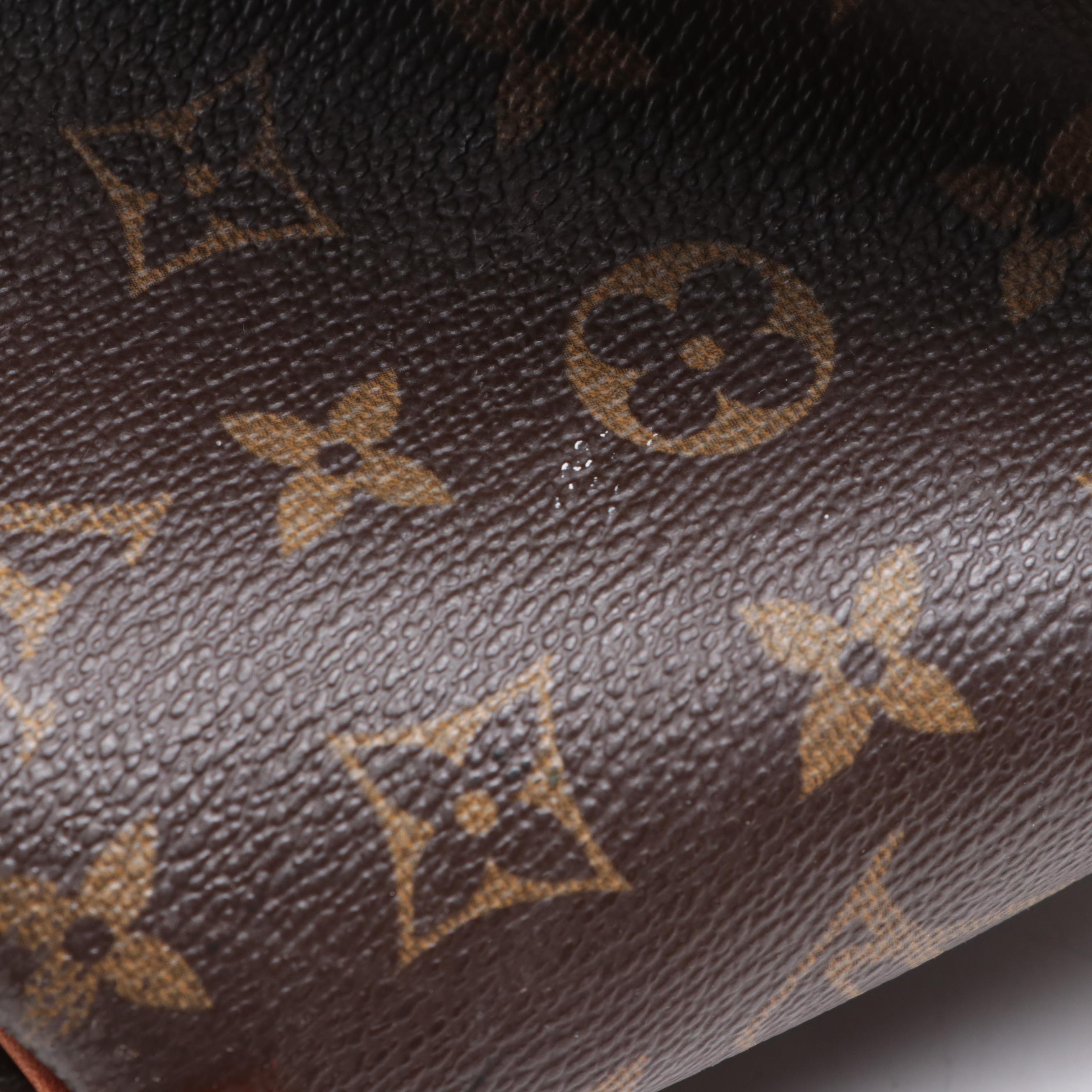Louis Vuitton Evasion Travel Bag in Monogram Canvas and Vachetta Leather
