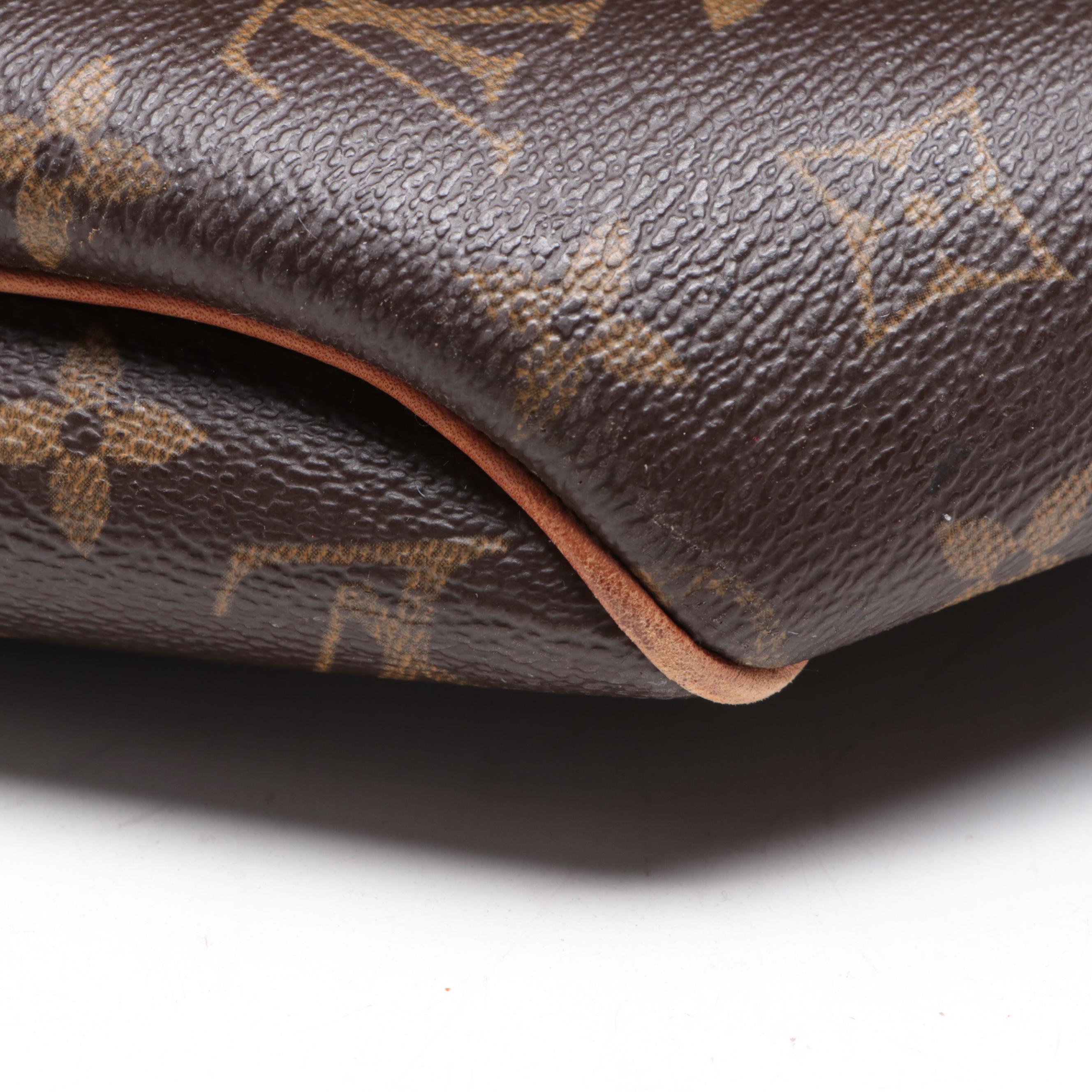 Louis Vuitton Evasion Travel Bag in Monogram Canvas and Vachetta Leather