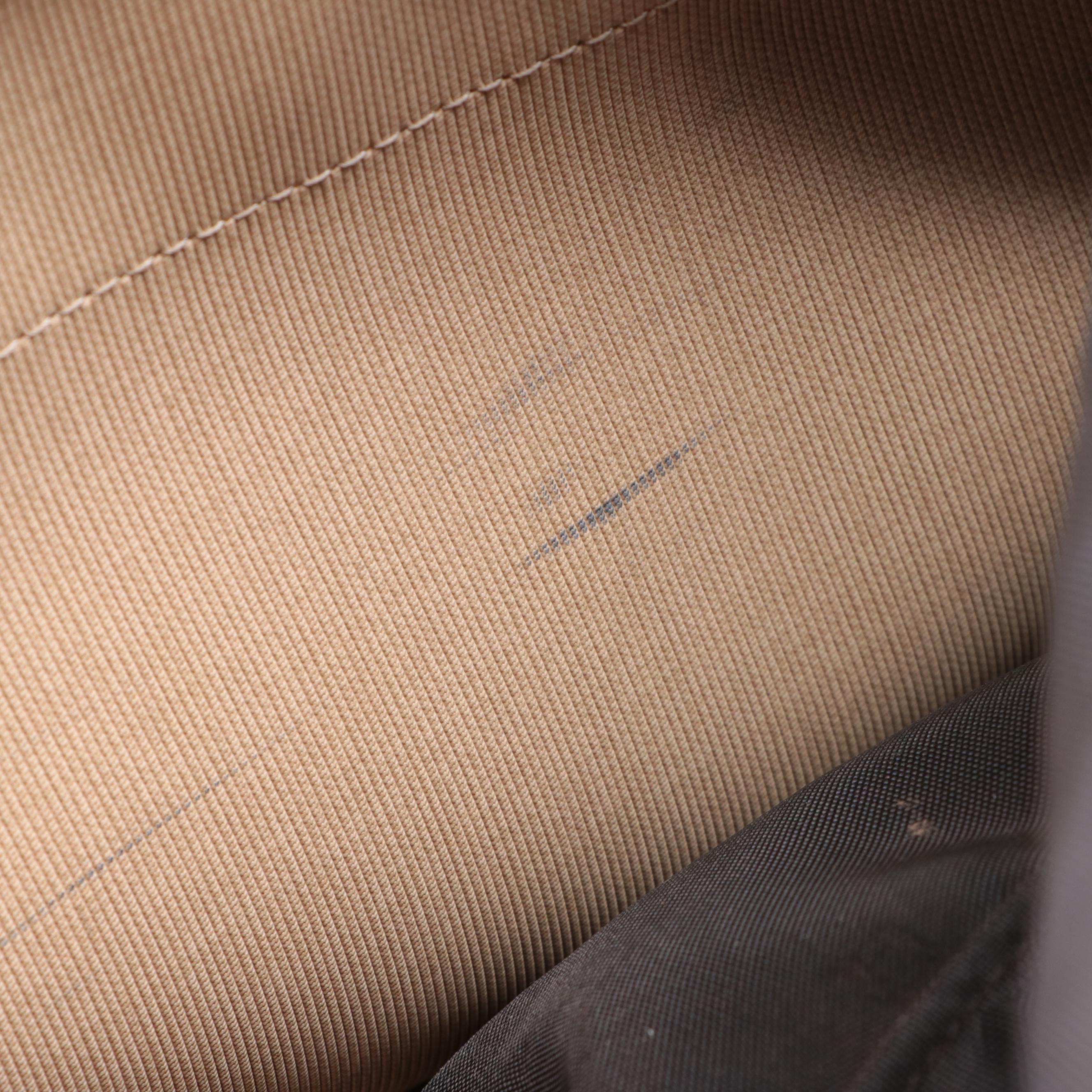 Louis Vuitton Evasion Travel Bag in Monogram Canvas and Vachetta Leather