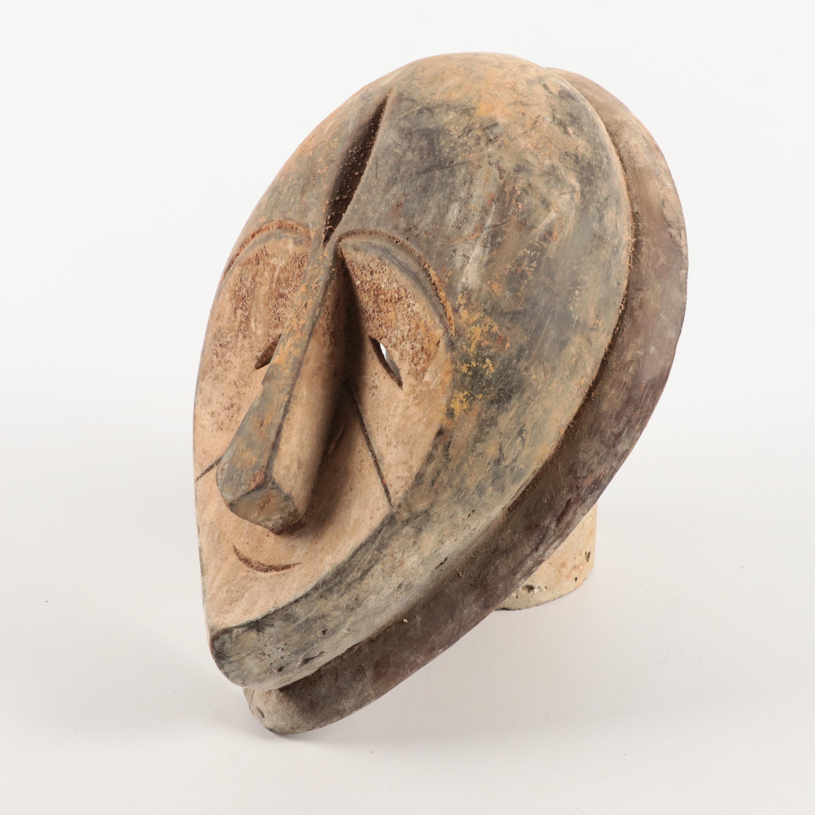 Lega and Igbo Style Carved Wooden Masks, Central Africa