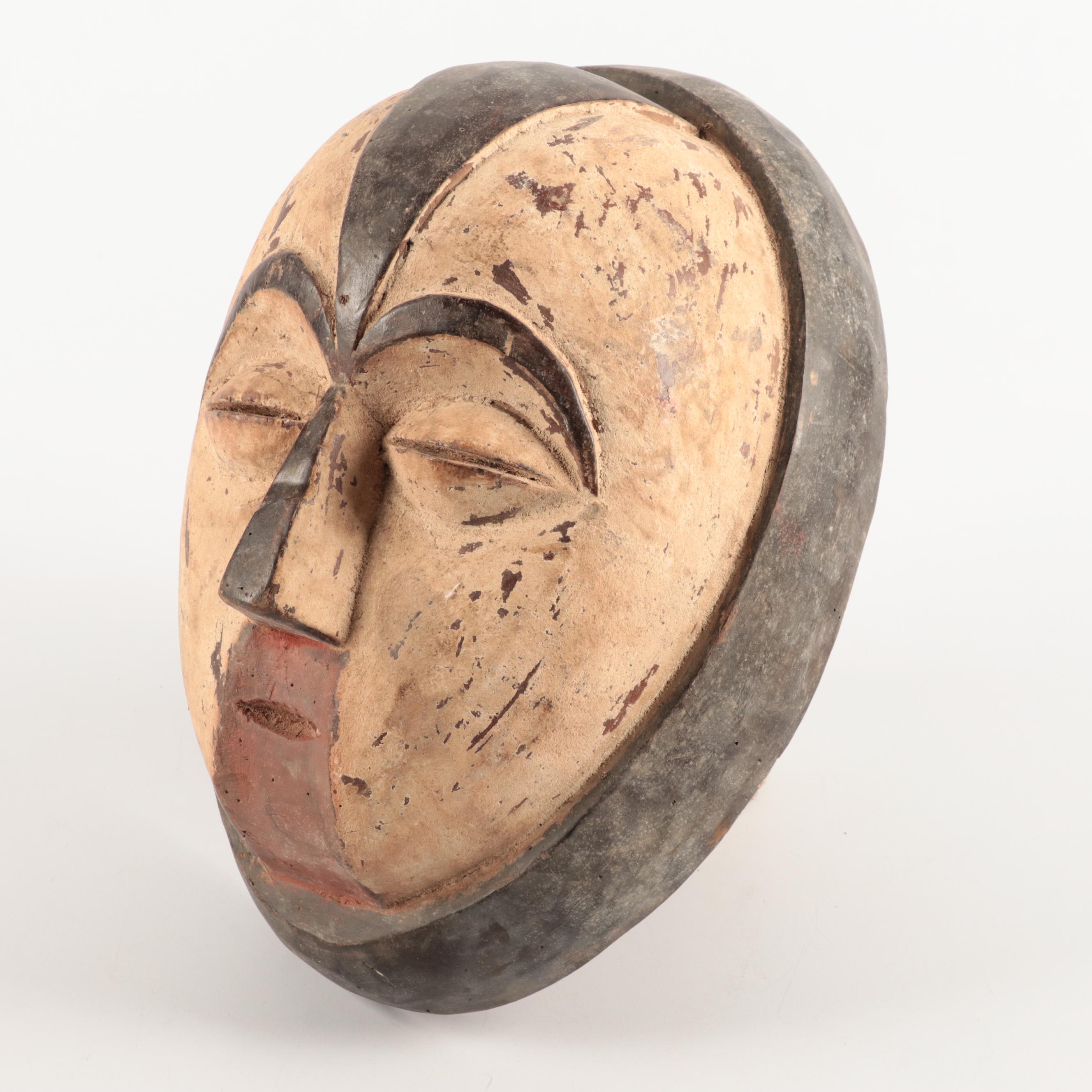 Lega and Igbo Style Carved Wooden Masks, Central Africa