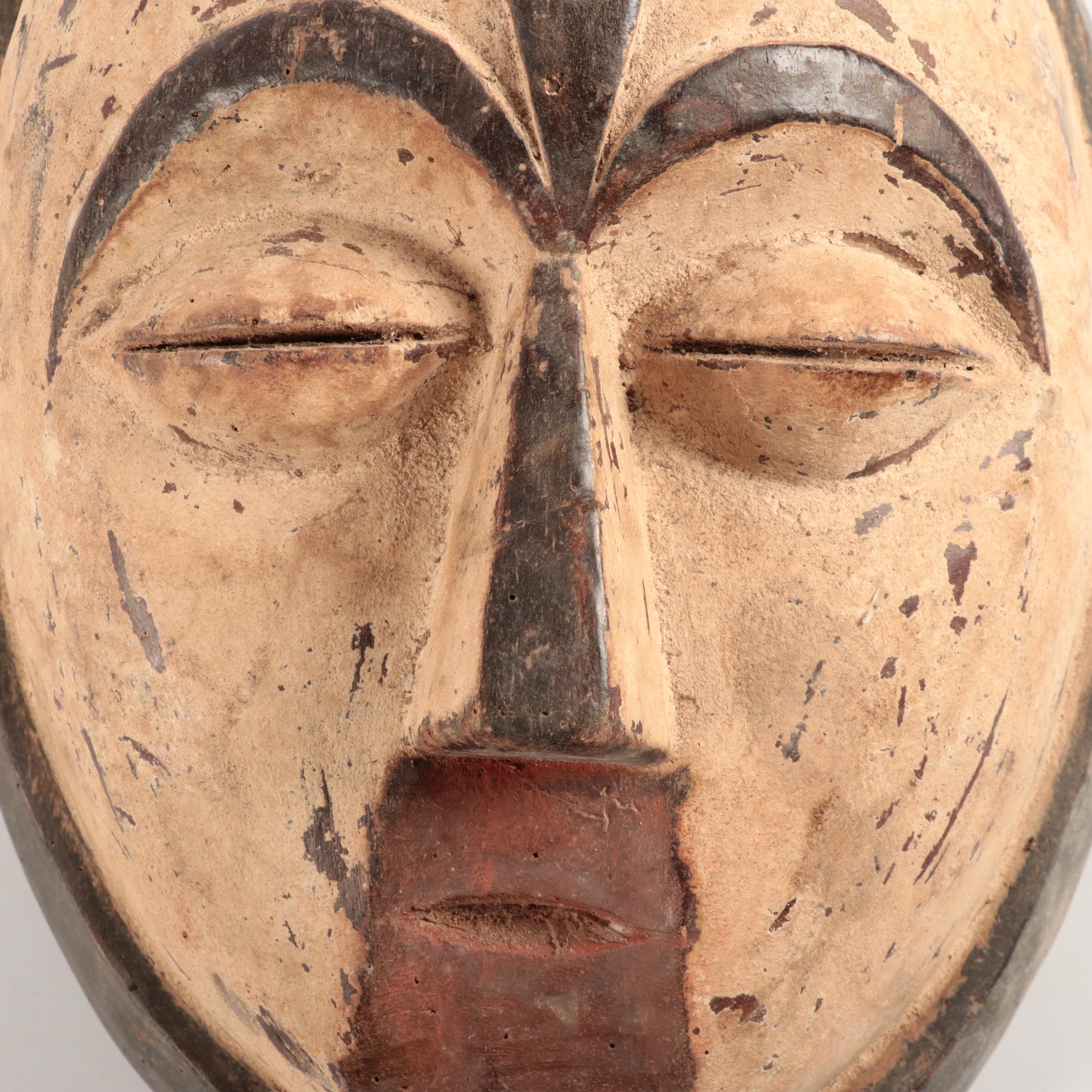 Lega and Igbo Style Carved Wooden Masks, Central Africa