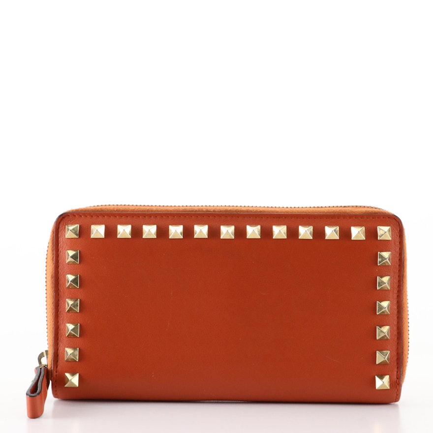 Valentino Garavani Rockstud Zip Wallet in Orange Leather