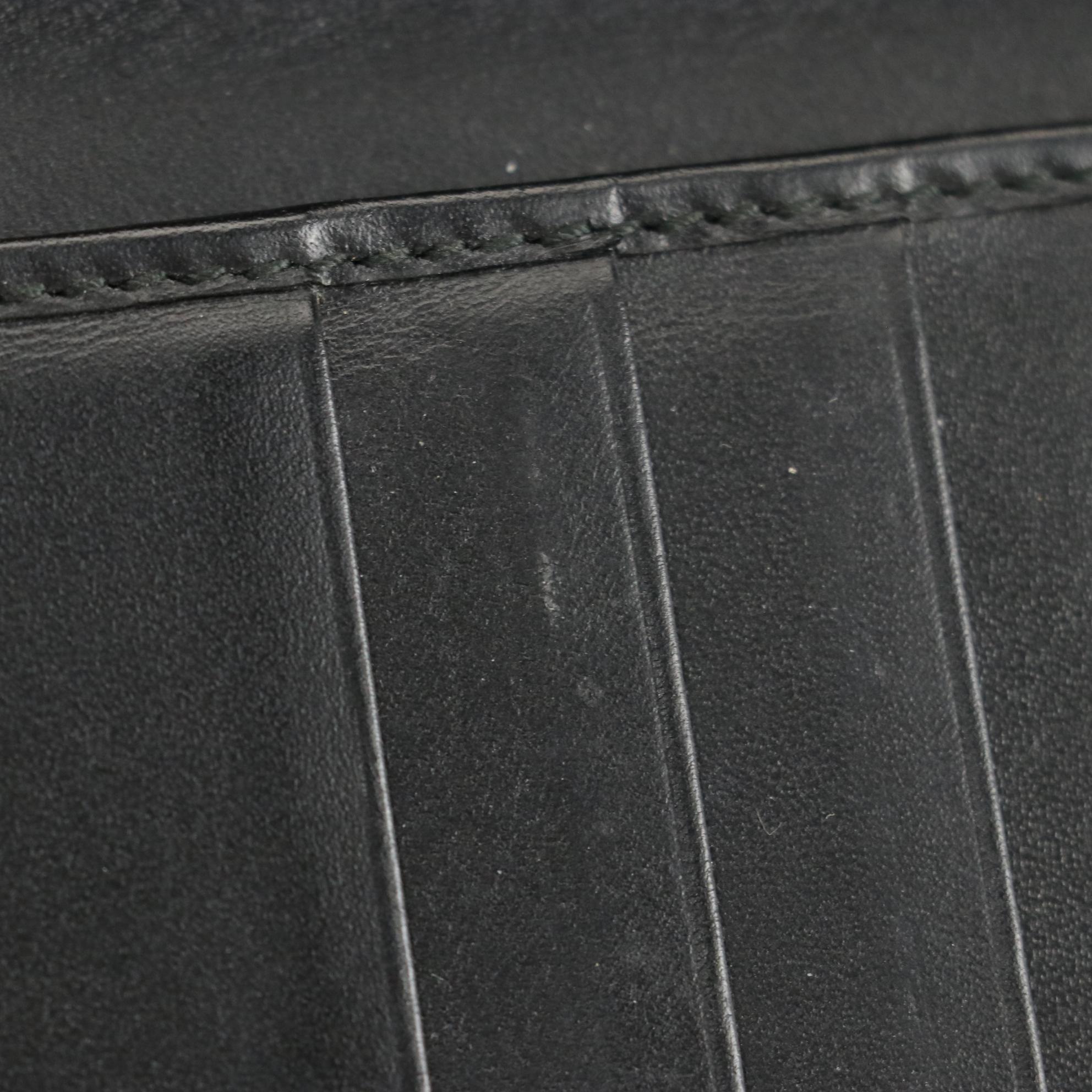 Gucci Checkbook Wallet in GG Embossed Leather