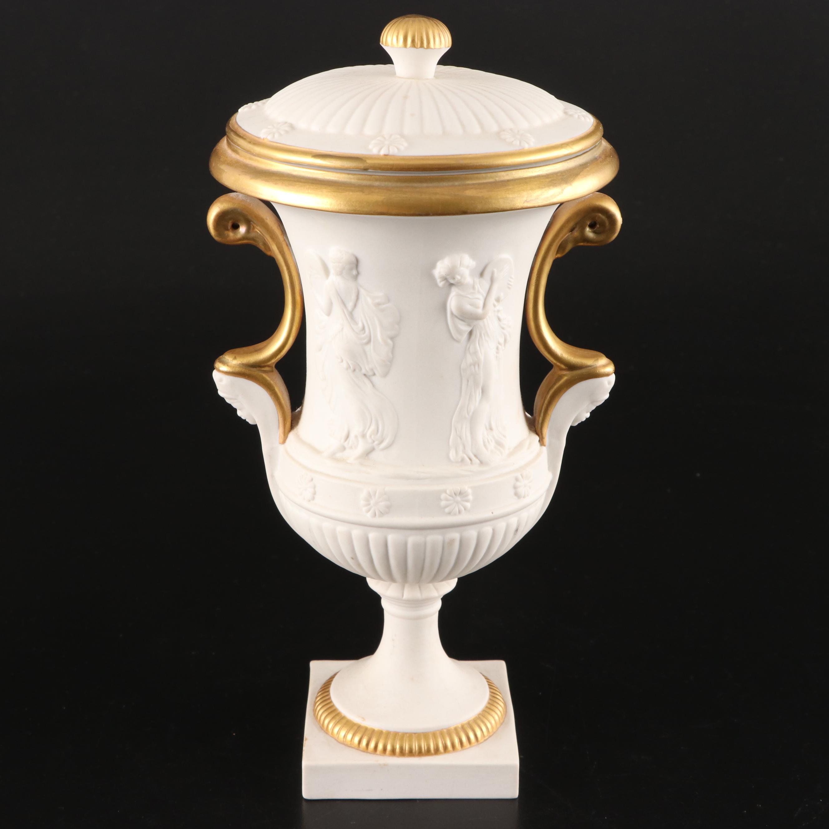 Pair of Italian Neoclassical Style Relief Bisque Porcelain Urns, Mid-20th C.
