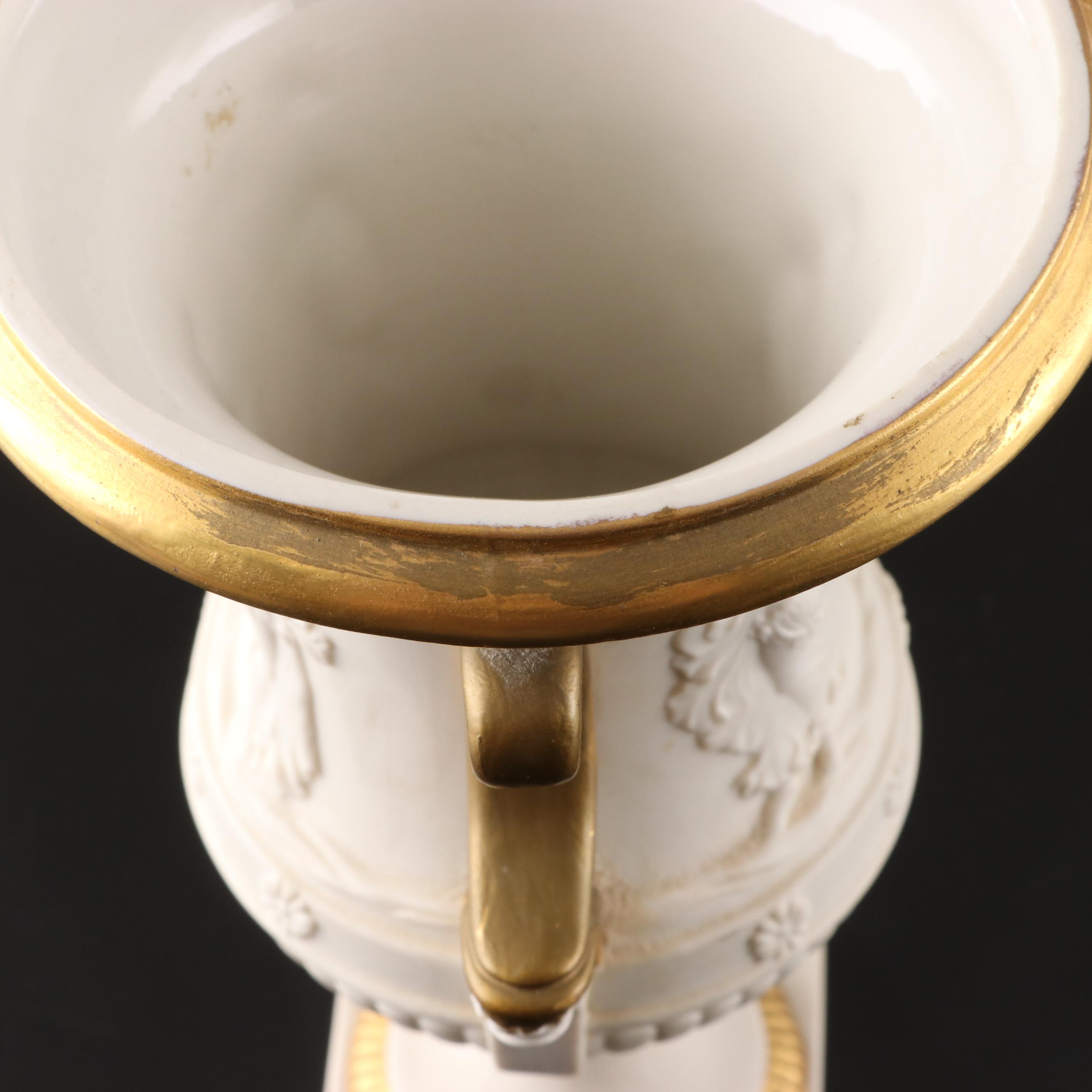 Pair of Italian Neoclassical Style Relief Bisque Porcelain Urns, Mid-20th C.