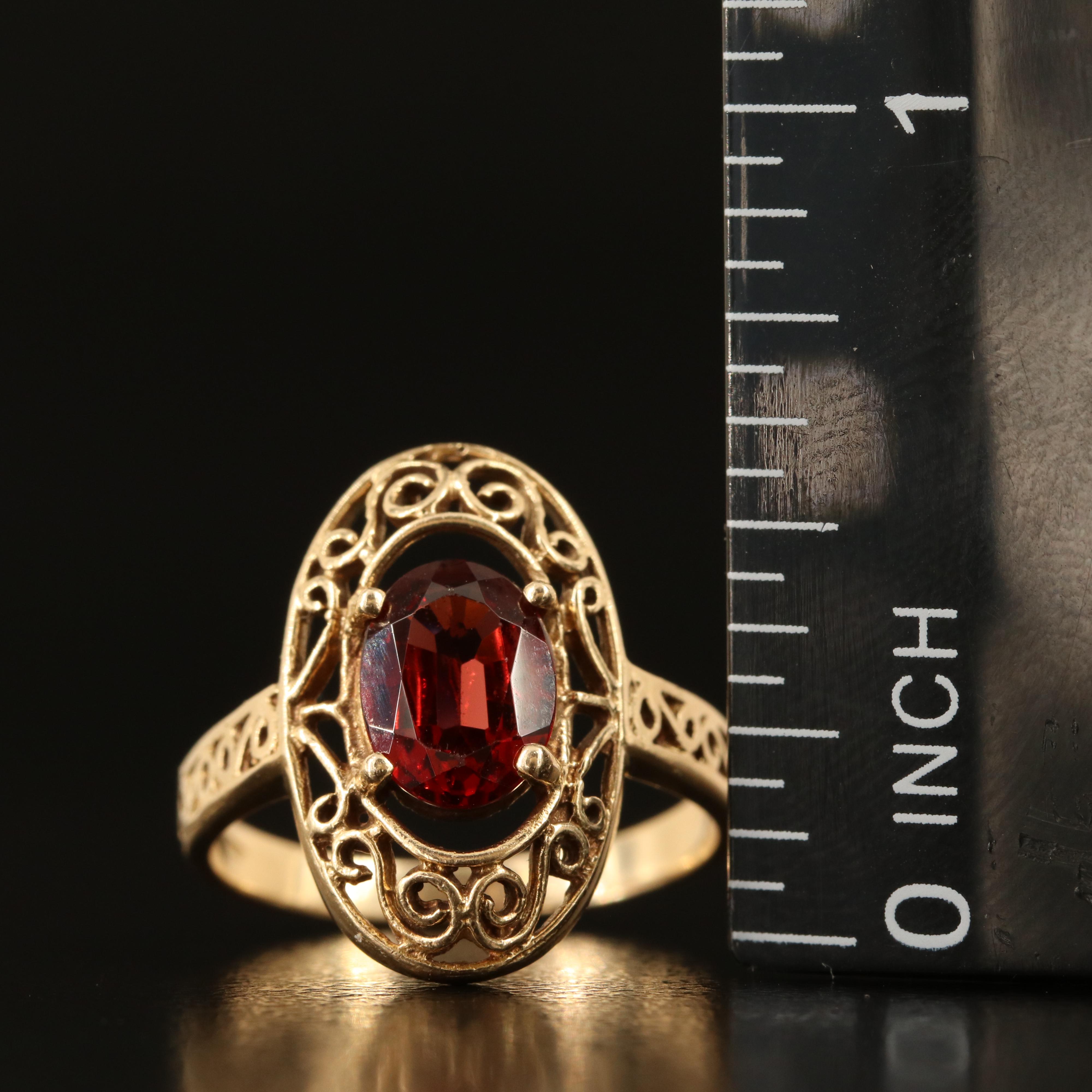 14K Garnet Oval Ring with Scroll Detail