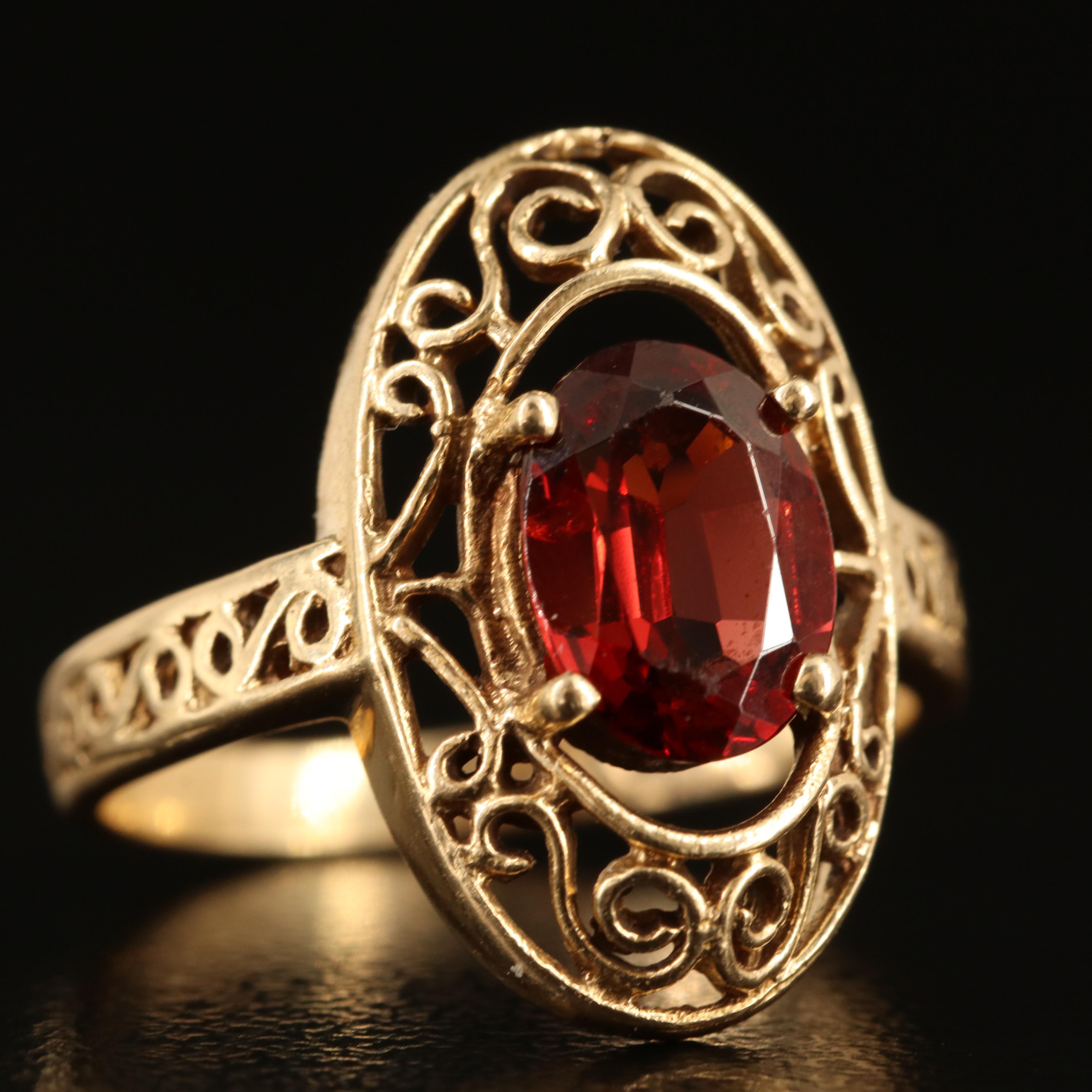 14K Garnet Oval Ring with Scroll Detail