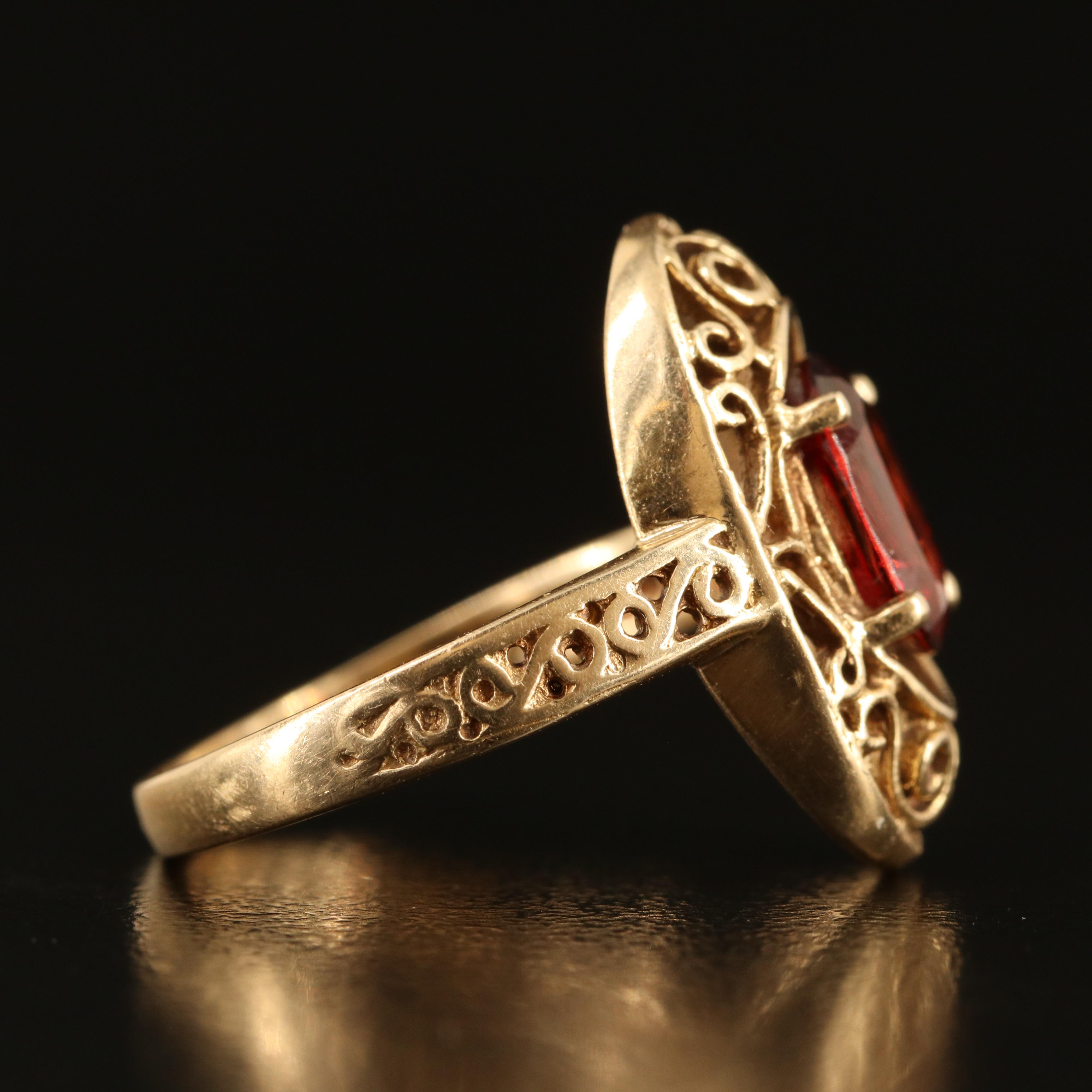 14K Garnet Oval Ring with Scroll Detail