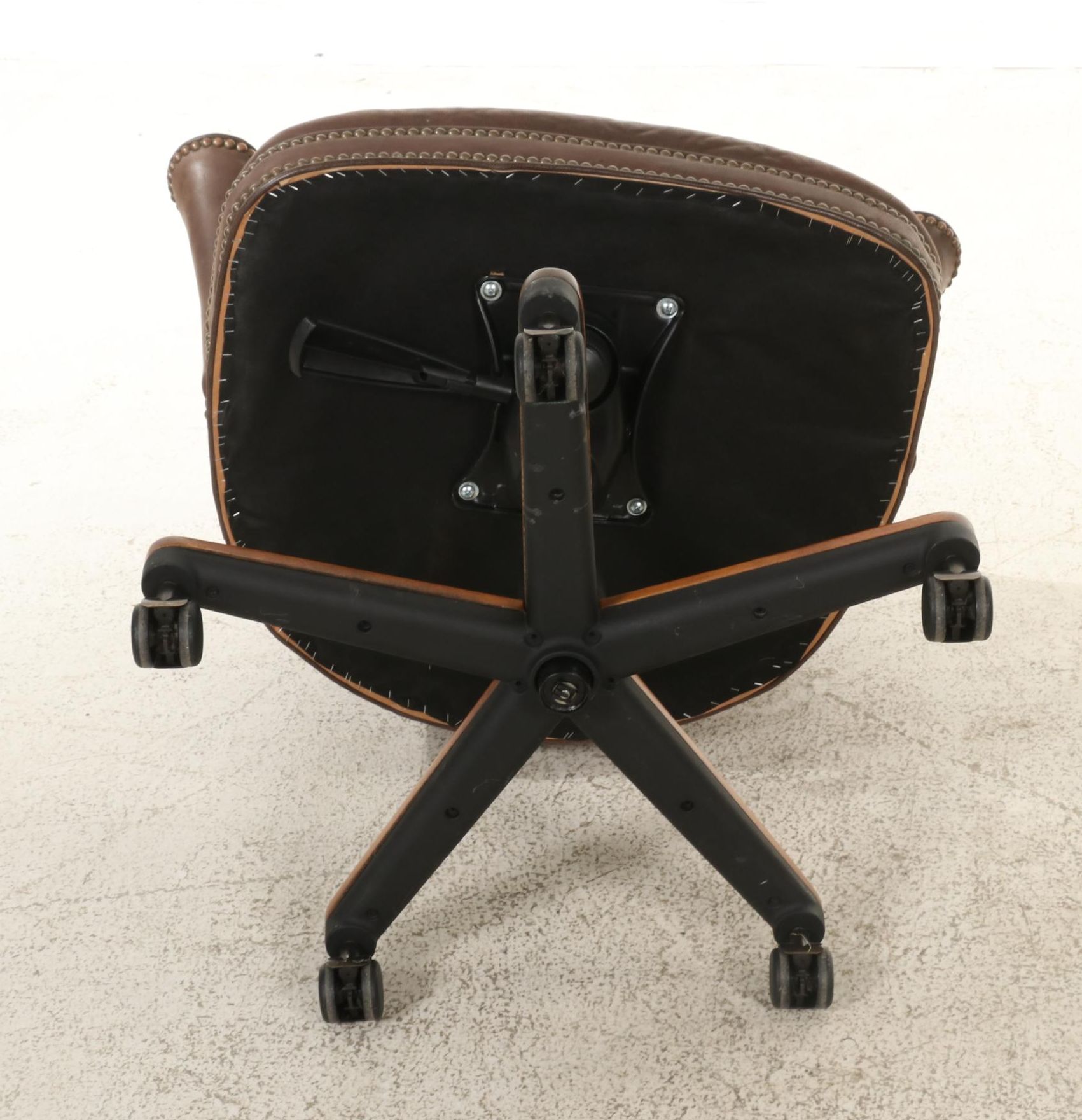 Pair of Brass-Tacked and Aged Leather Upholstered Adjustable Swivel Chairs